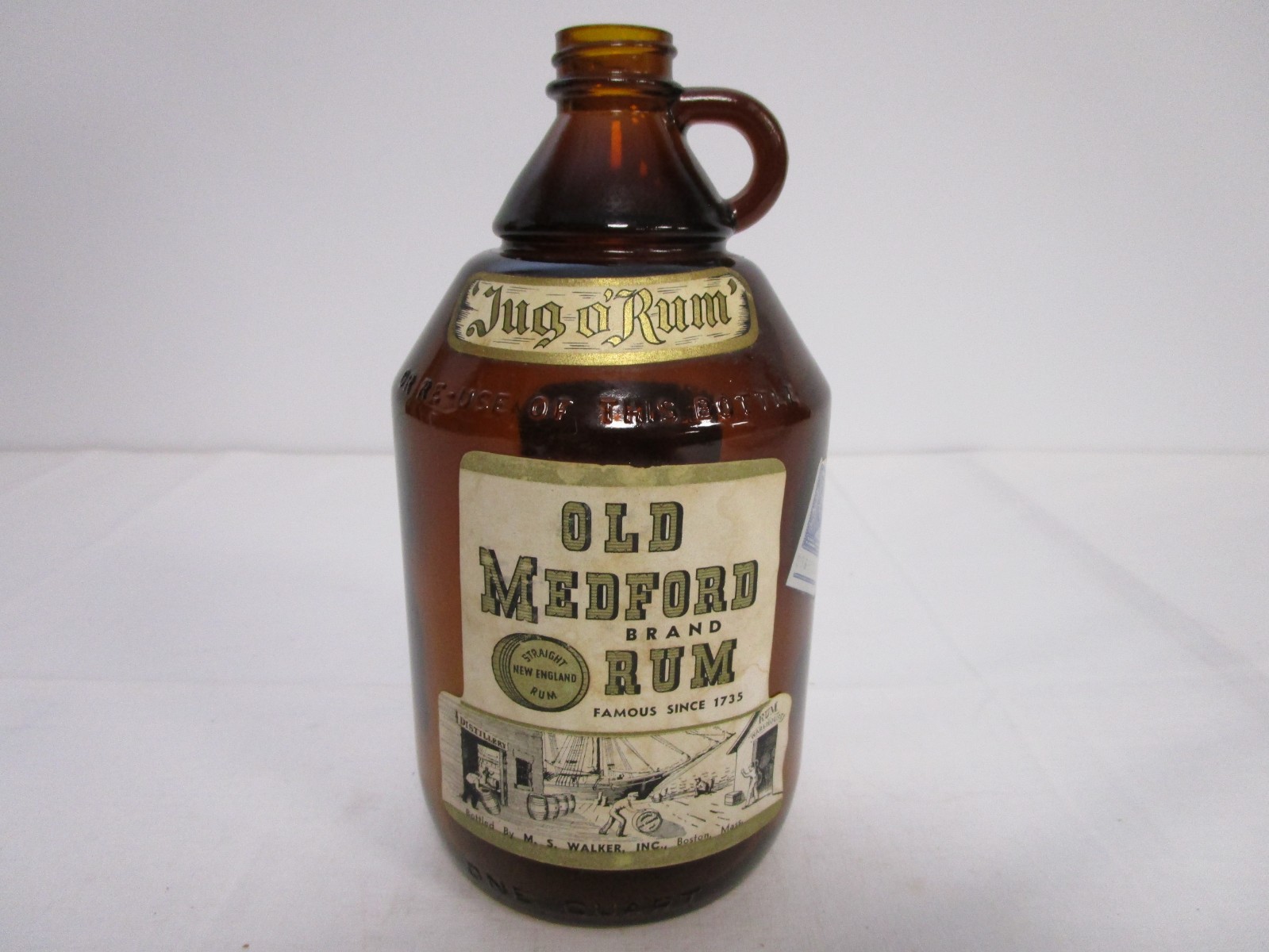 Vintage Old Medford Rum Glass Jug Bottle has descriptive label on the back