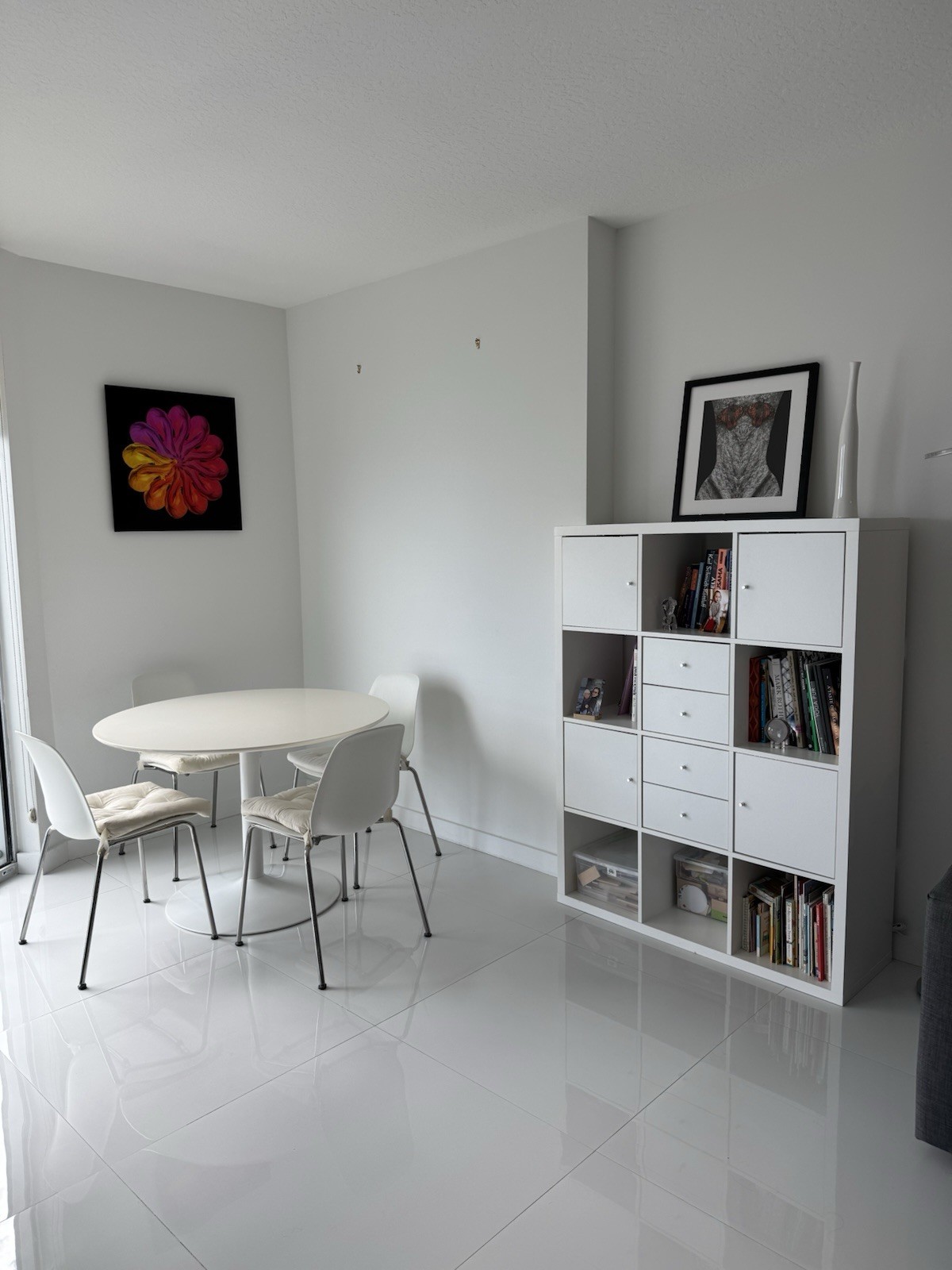 White Round Dining Table With Four Chairs And Bookcase