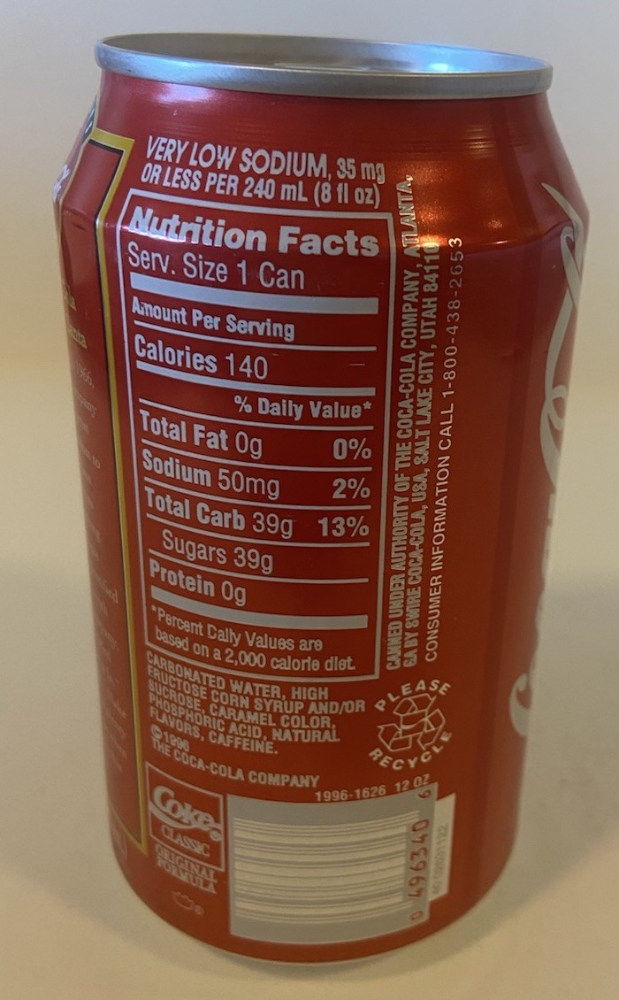 1996 12 oz. COKE CAN ( SANTA WITH DOG ) EMPTY BOTTOM OPENED