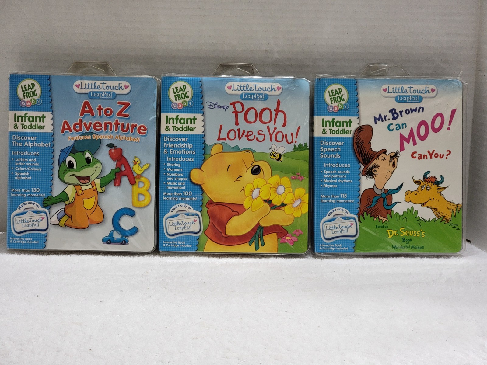 LOT OF 3  LEAP FROG LITTLE TOUCH LEAP PAD BOOKS & CARTRIDGES W/CASES MR BROWN +