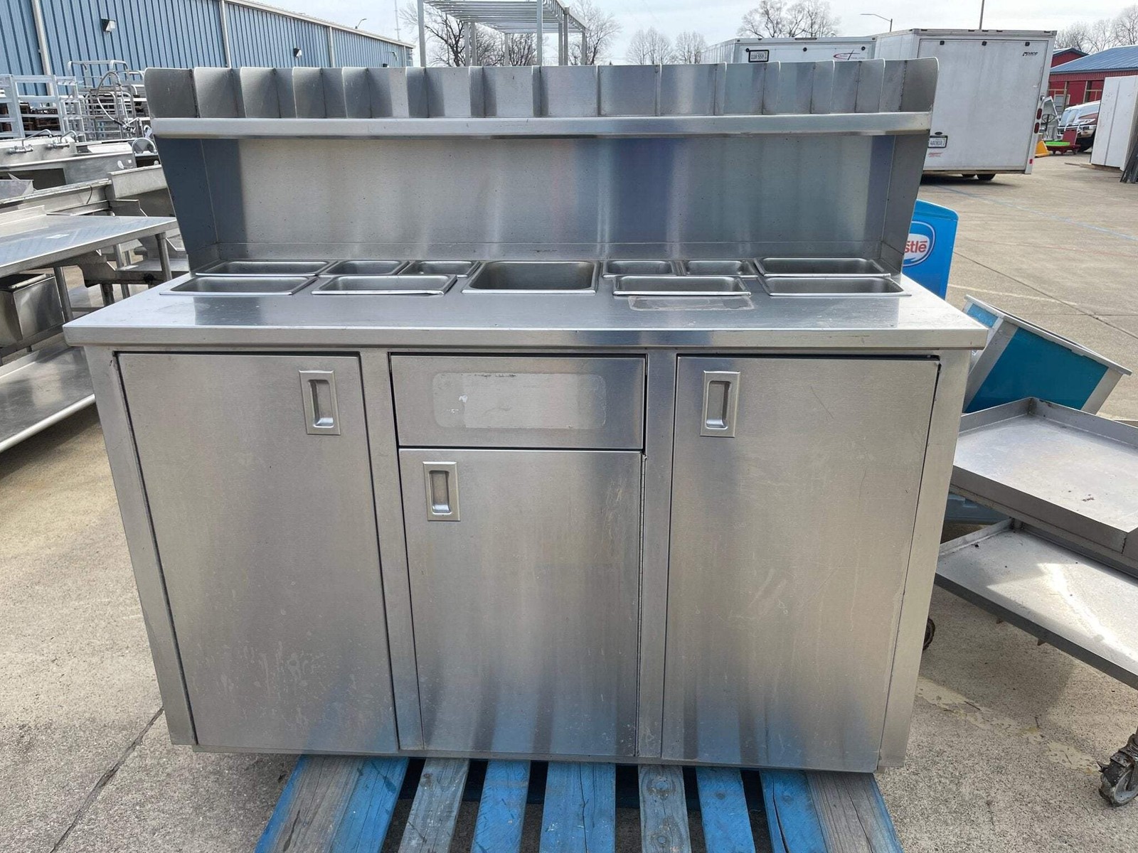 Used 60" Stainless Steel Condiment Station Cabinet with Trash Can Compartment -