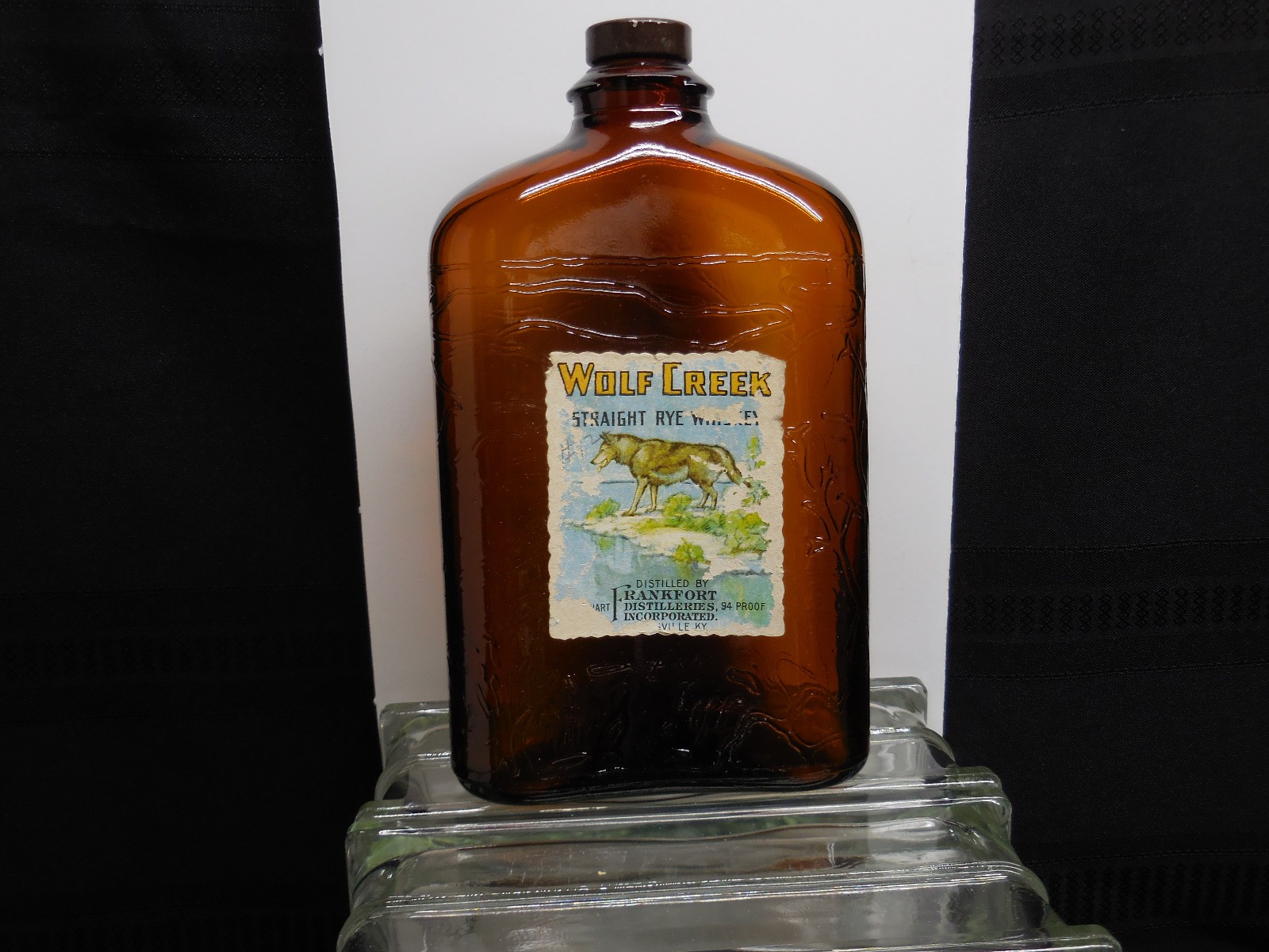 Whiskey bottle, 1934, WOLF CREEK Rye quart, embossed bottle with labels and cap
