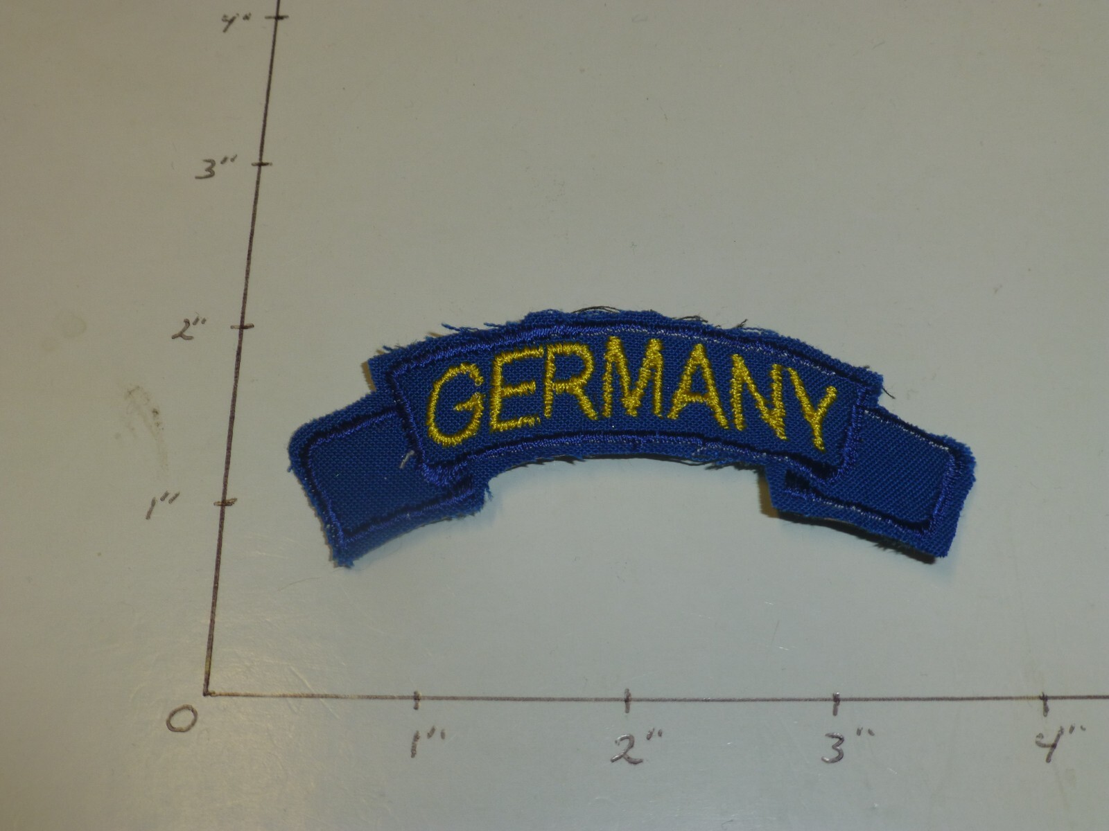 Germany tab gold letters blue border on blue for 8th Division patch