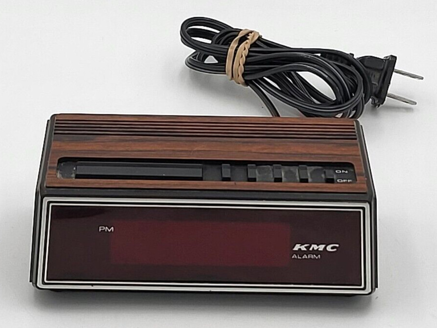 KMC Alarm Model No. KMC-1108 5"x3"x2" Woodgrain Finish Red Display - Used/Works