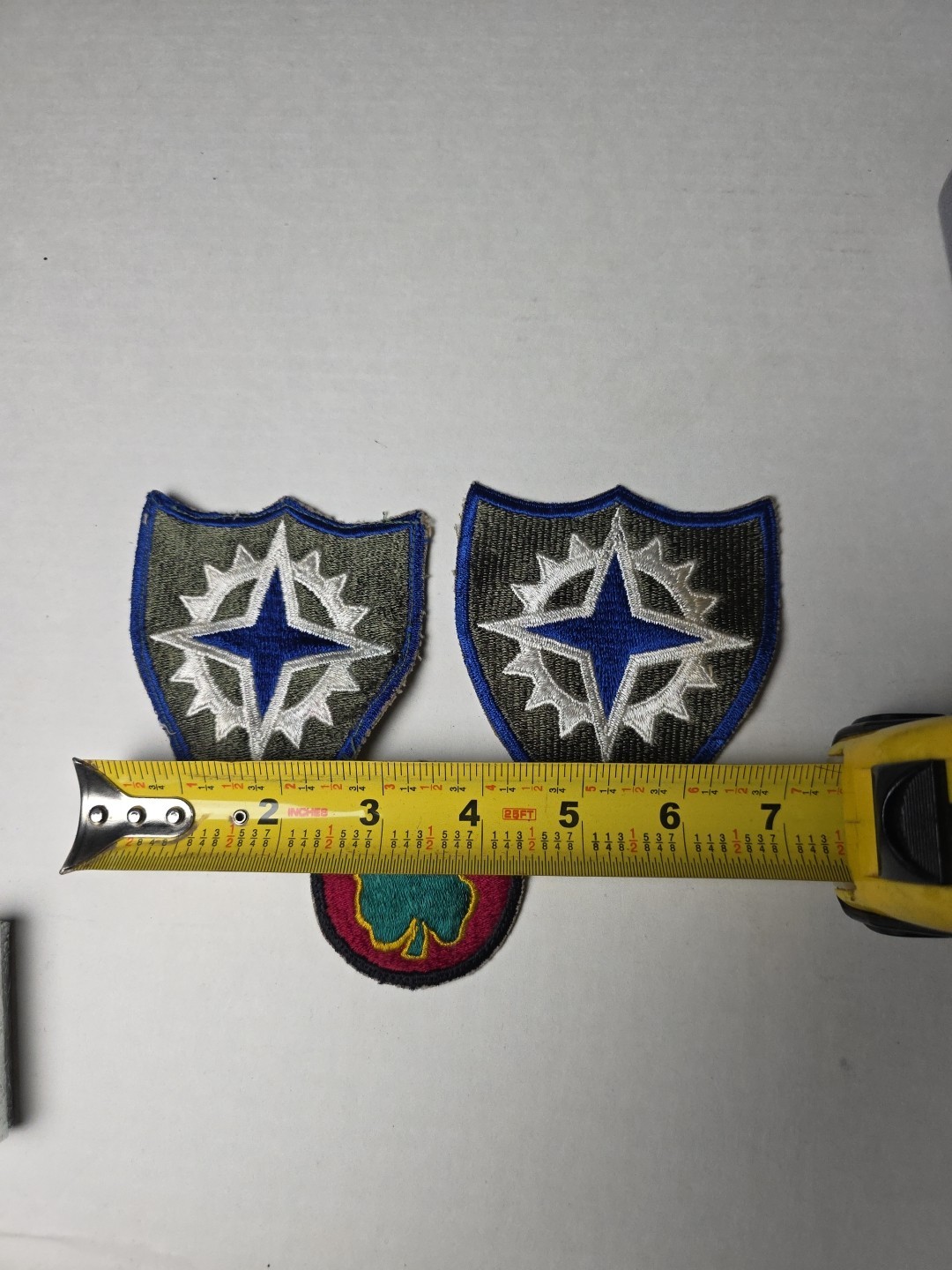 U.S. Army XVI Corps (16th Army Corps) patches, from the World War II era. 1945