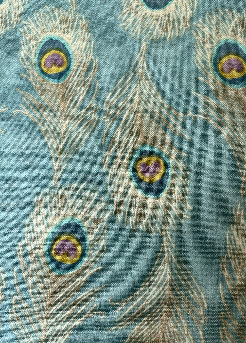 "Indian Peacock Feathers" 100% cotton print in cream, blues and greens