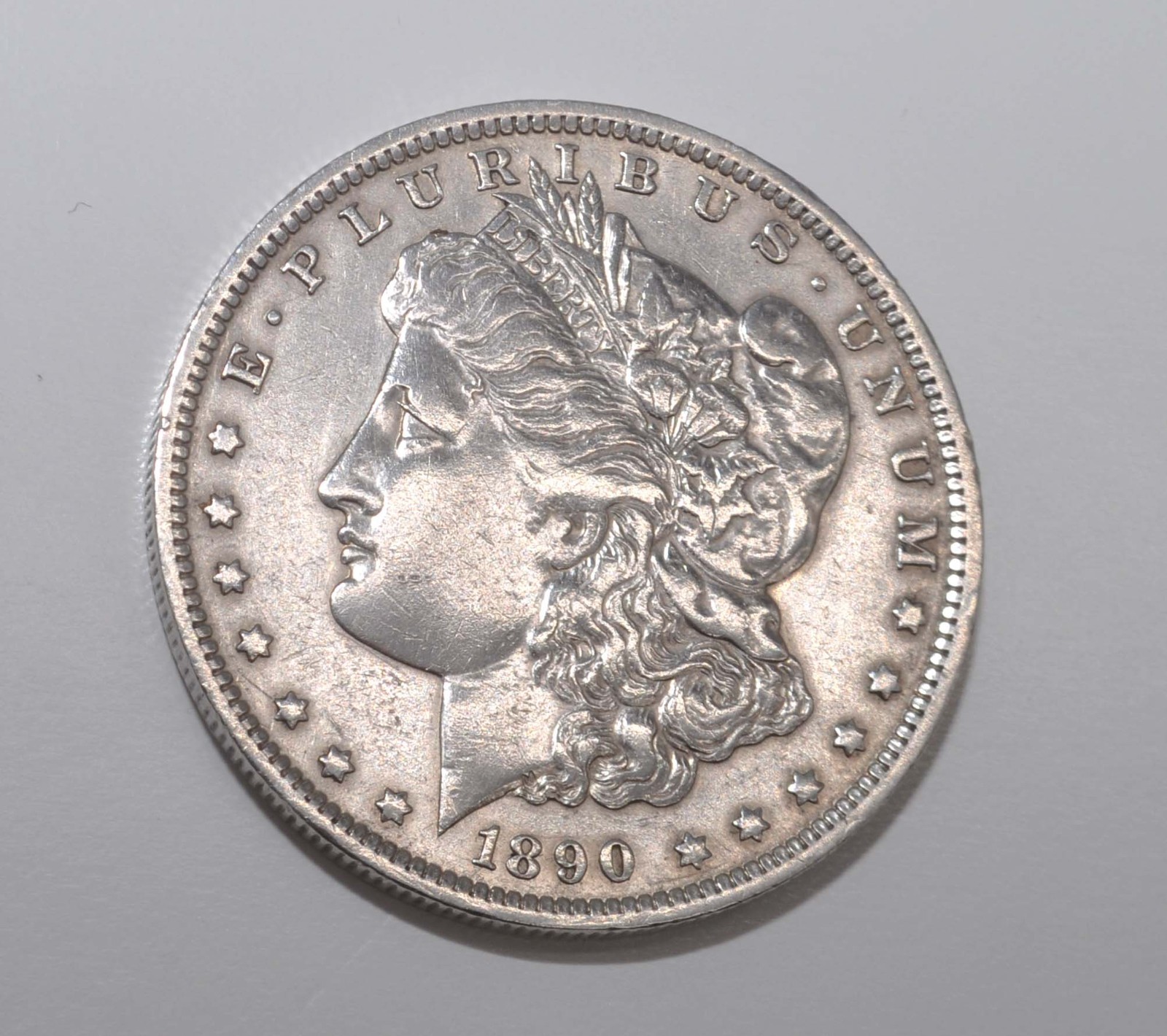 1890-O Morgan Silver Dollar About Uncirculated High Grade