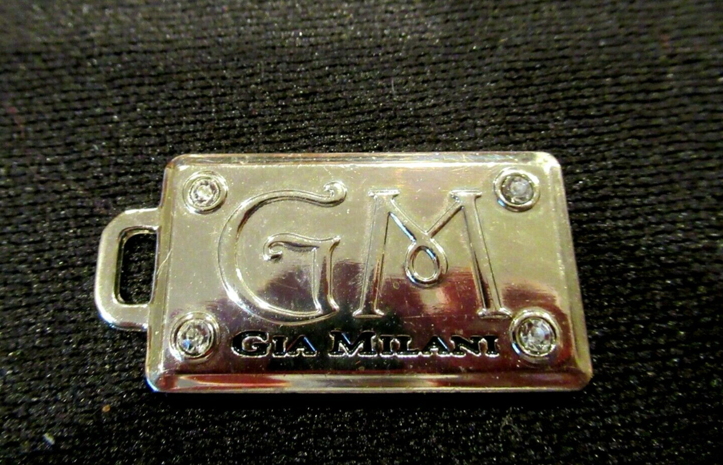 Gia Milani silver metal hang tag / bag charm