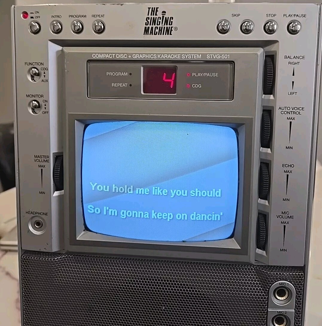 The Singing Machine Compact Disc Digital Audio Graphics With Microphone