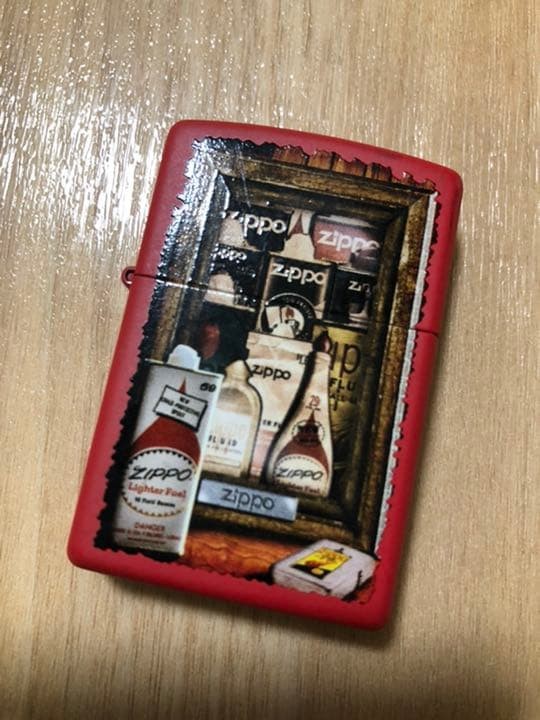 A Zippo lighter with a design of a liquor bottle