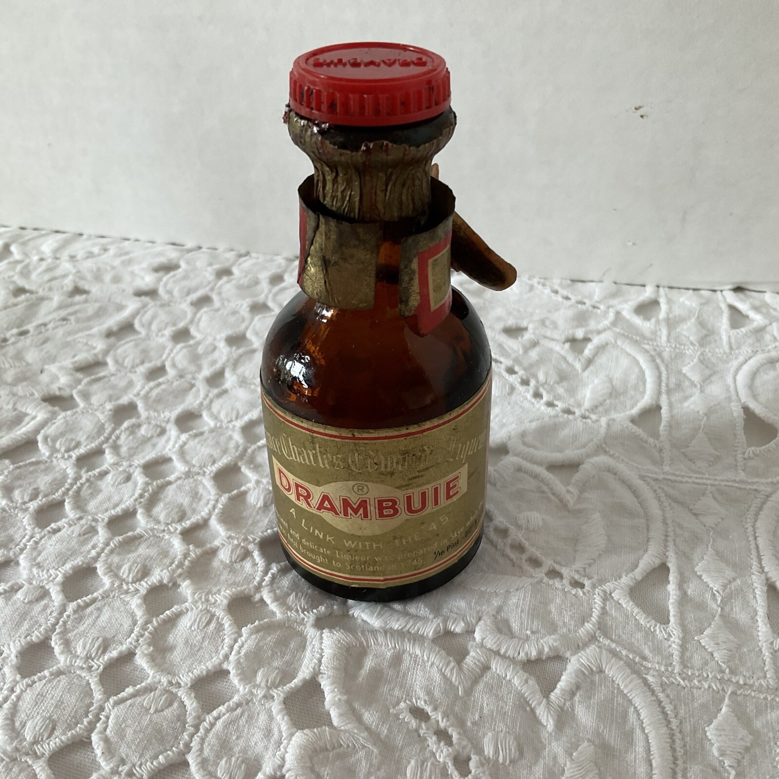 Empty Drambuie Liquor Bottle Label Around Neck is Loose Mini Size Brown Glass
