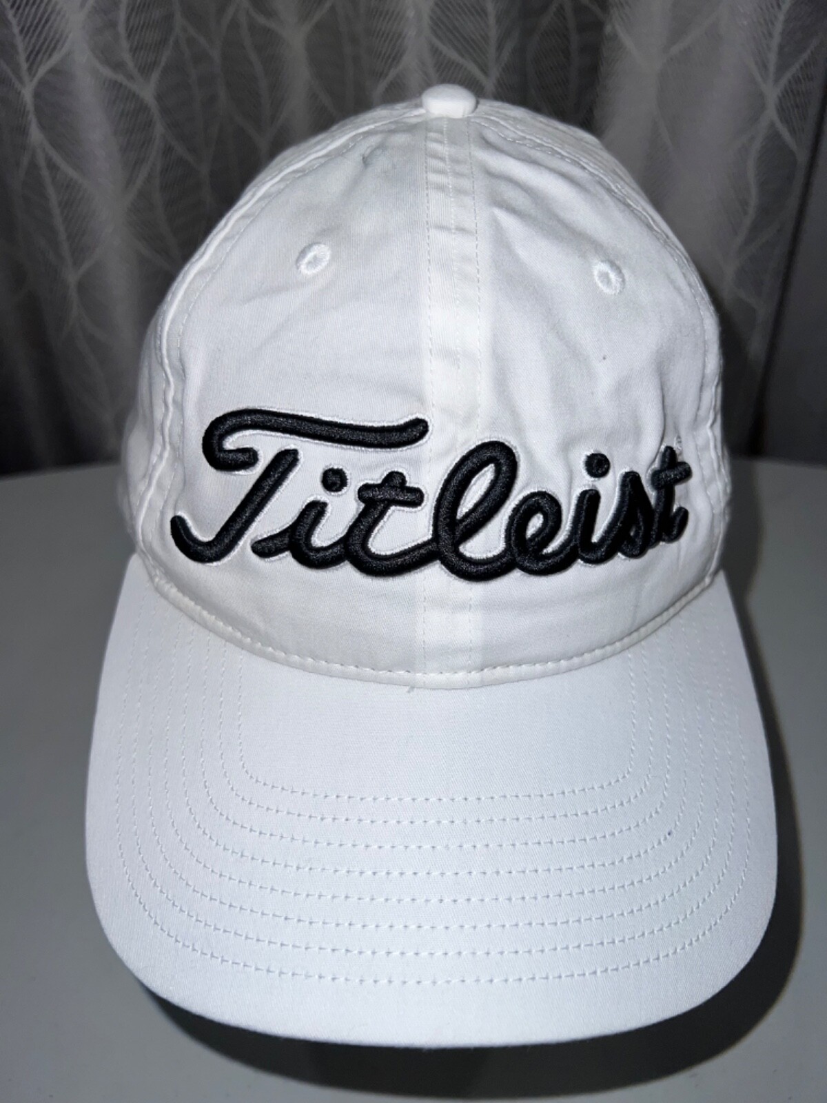 Titleist embroidered in Black on White on White Hat Cap Hook Loop Gray Band EUC