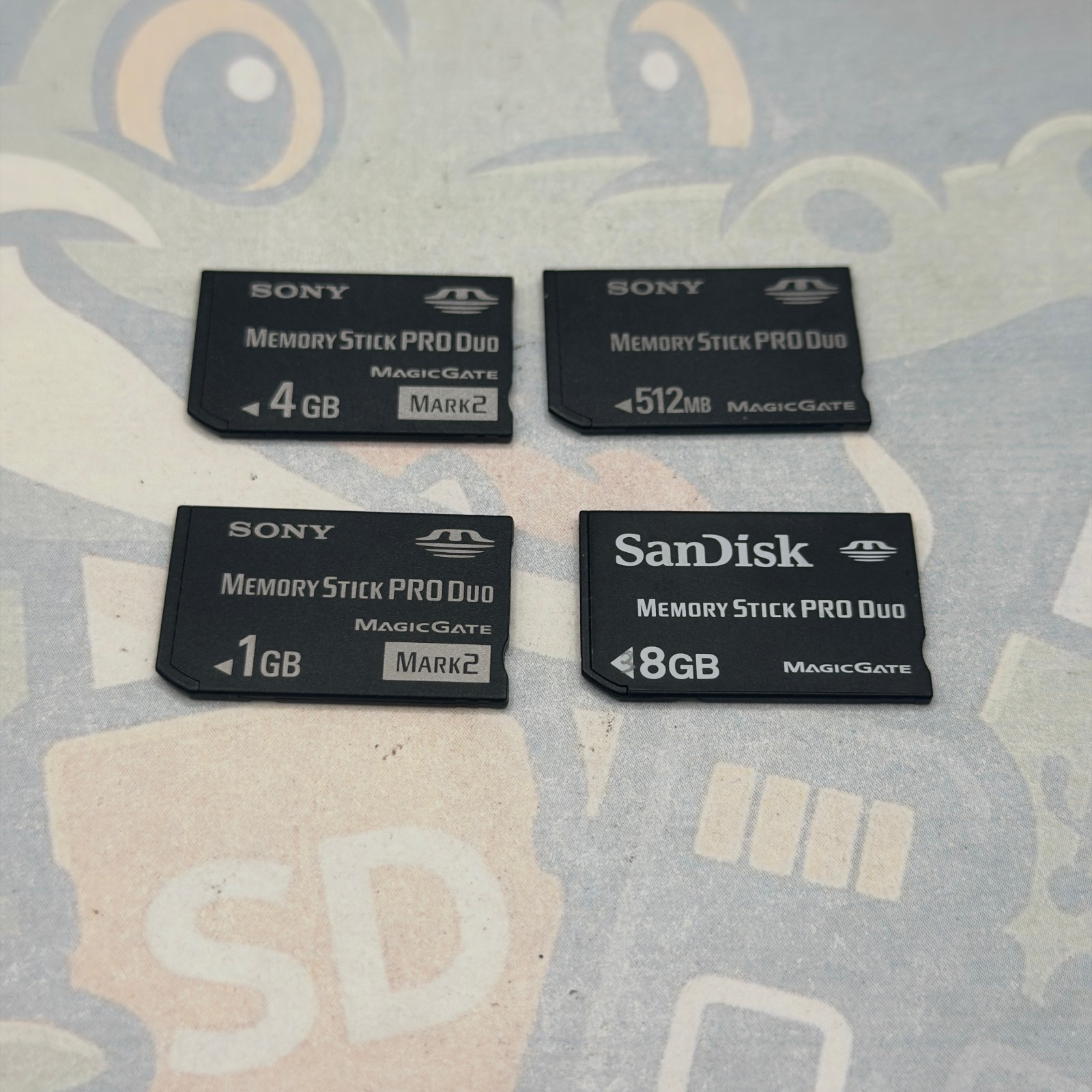 LOT of 4 MemoryStickDUO Cards - Various Sizes - Untested - Various Brands- GC941