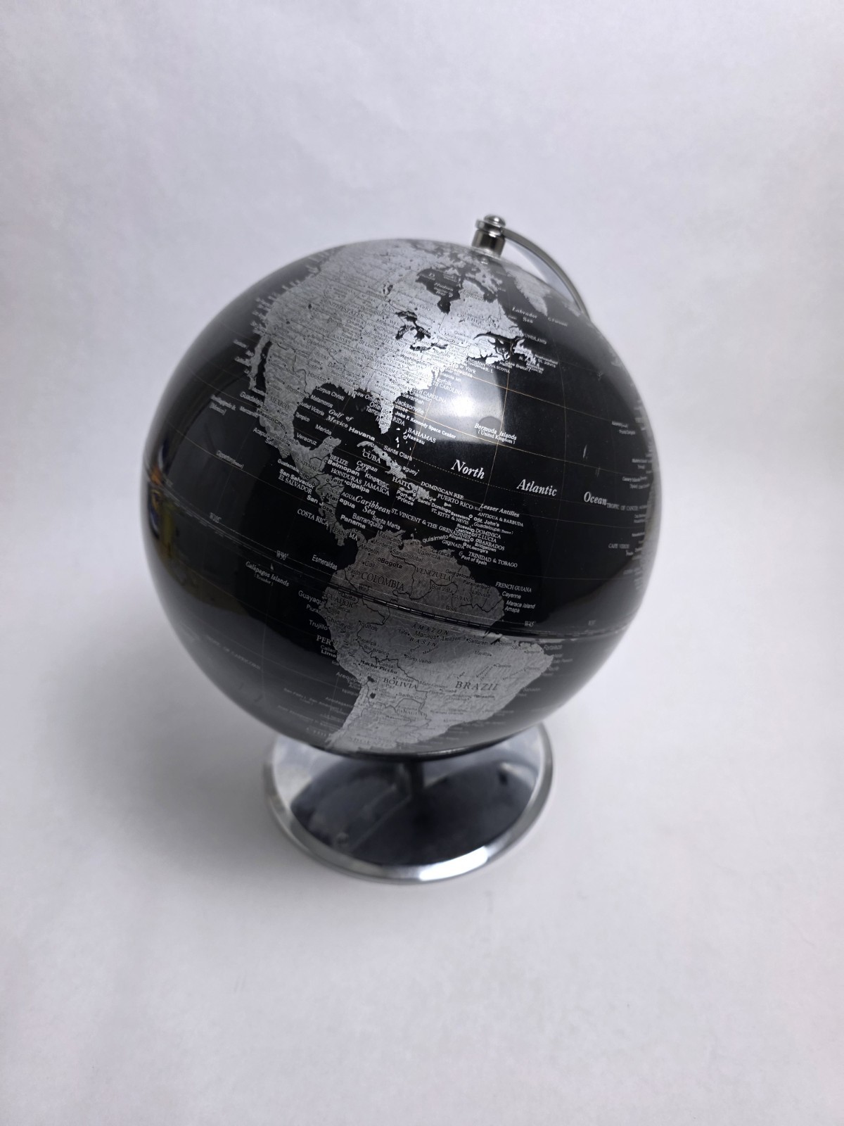 Modern Black Silver Rotating Tabletop Globe with Metallic Finish and Metal Base