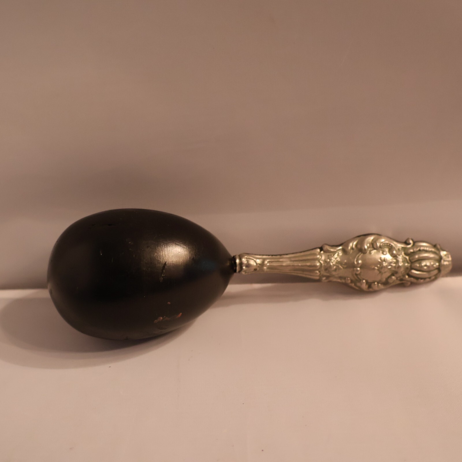 Darner with silver handle