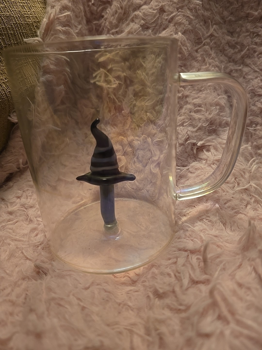 Iridescent Glass Mug With A Witch Hat Attached To Inside Of Mug.