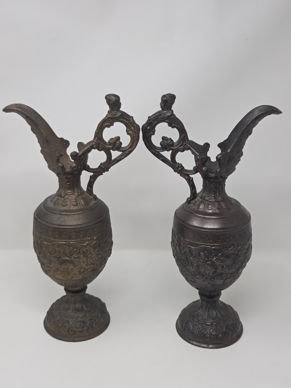 Pair Of Ornate Cast Bronze Decorative Ewers With Figural Handles & Relief Detail