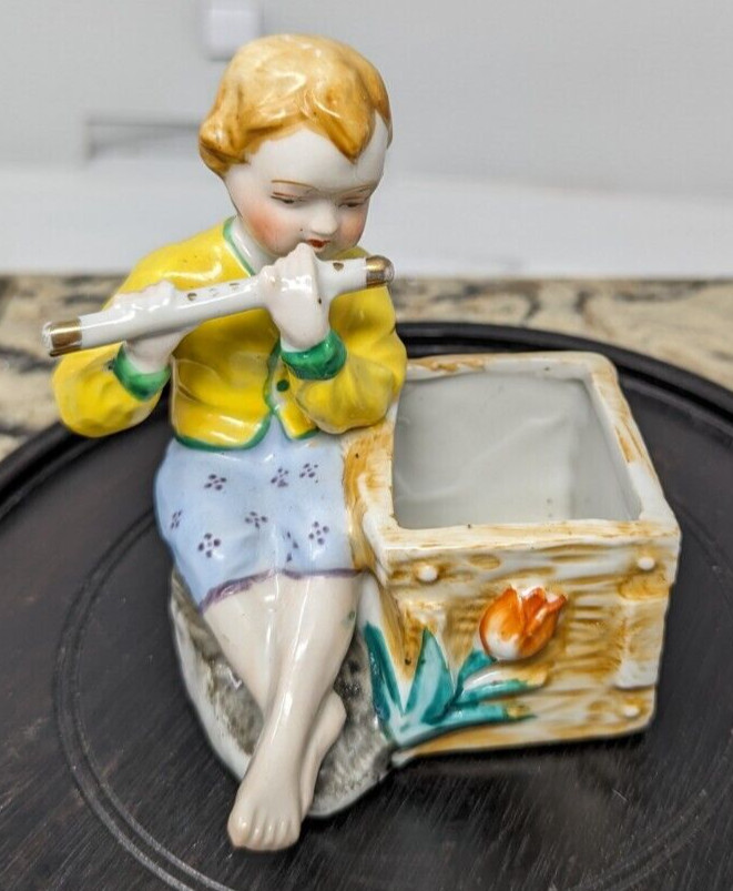 Japan brightly colored miniature planter strawberry blonde child with flute