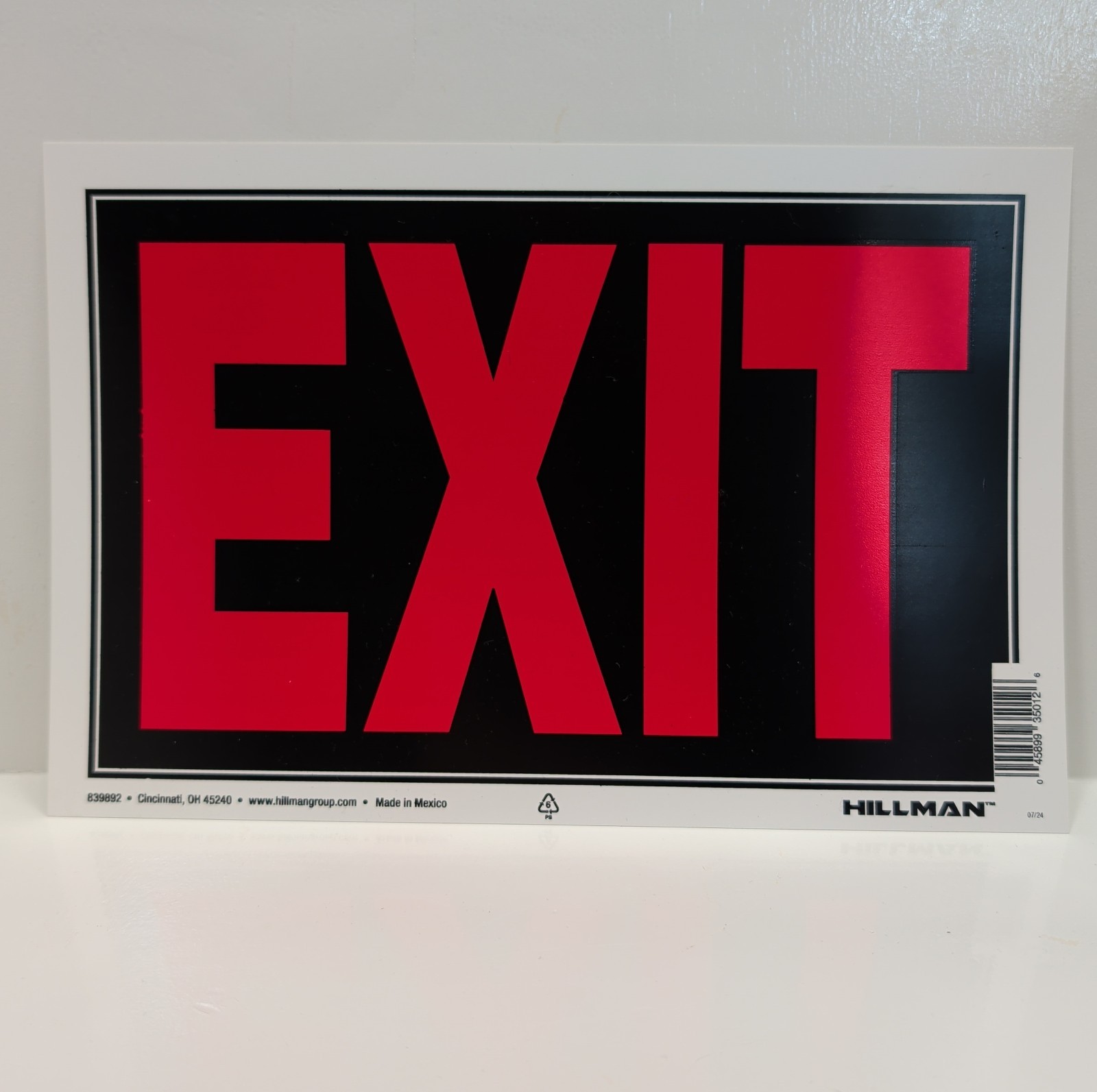 Hillman Exit Sign Red Letters Black Background White Backing Indoor Outdoor