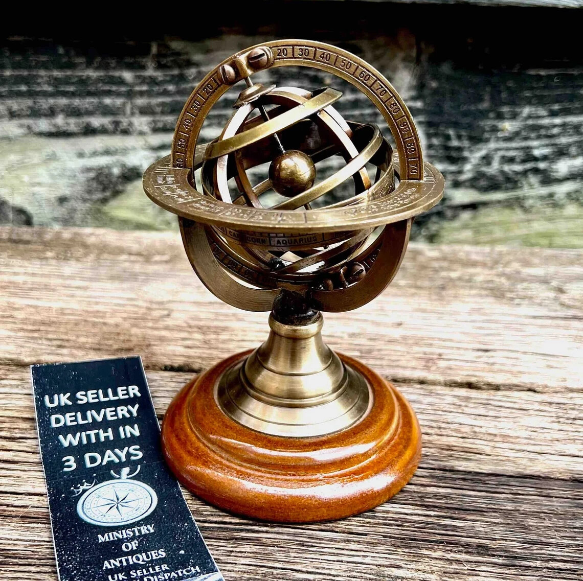Vintage Armillary Sphere on Elegant Wooden Base: A Nostalgic Decor Accent for Yo