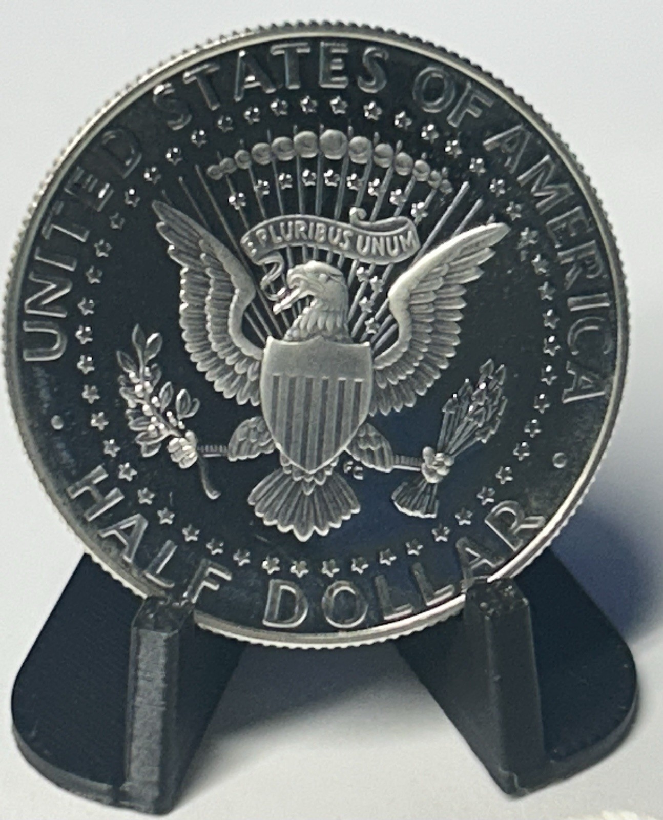 1999-S SILVER PROOF KENNEDY HALF in a plastic holder with stand for displaying
