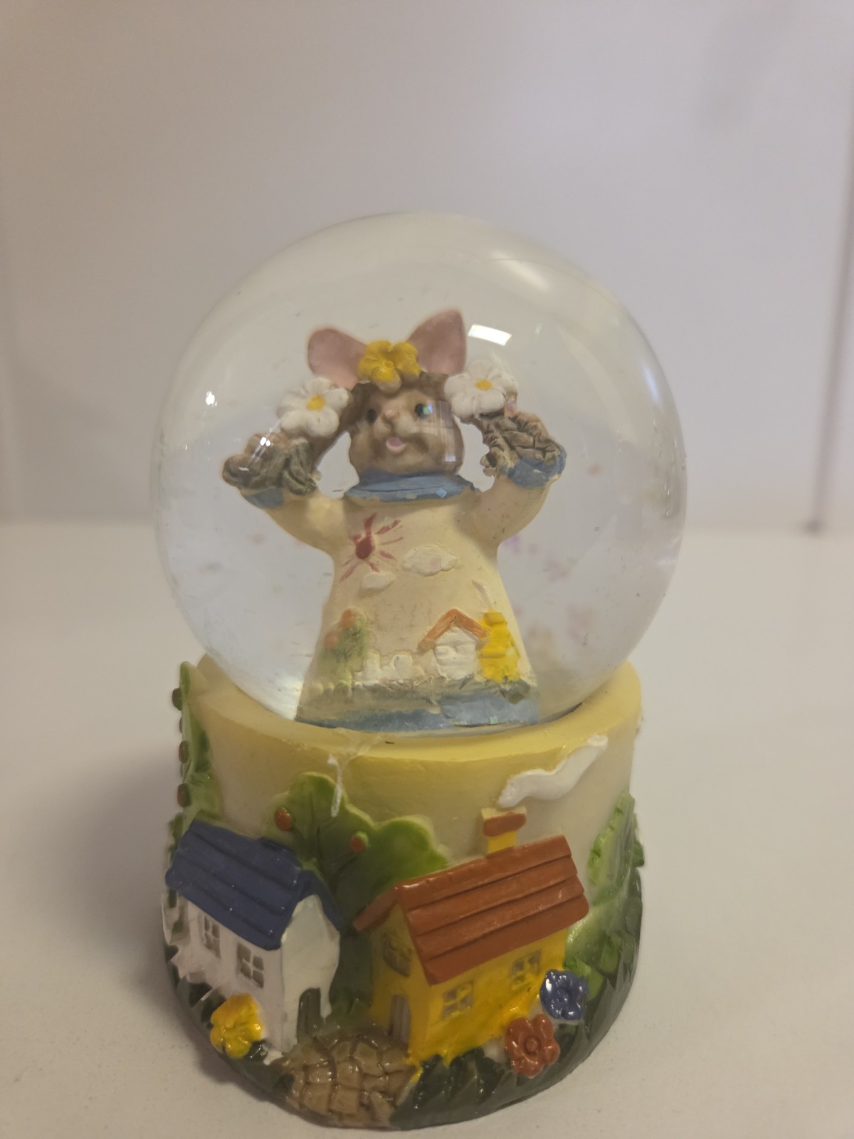 Mini glitter globe stands 3 1/2 inches tall with Bunny and Flowers