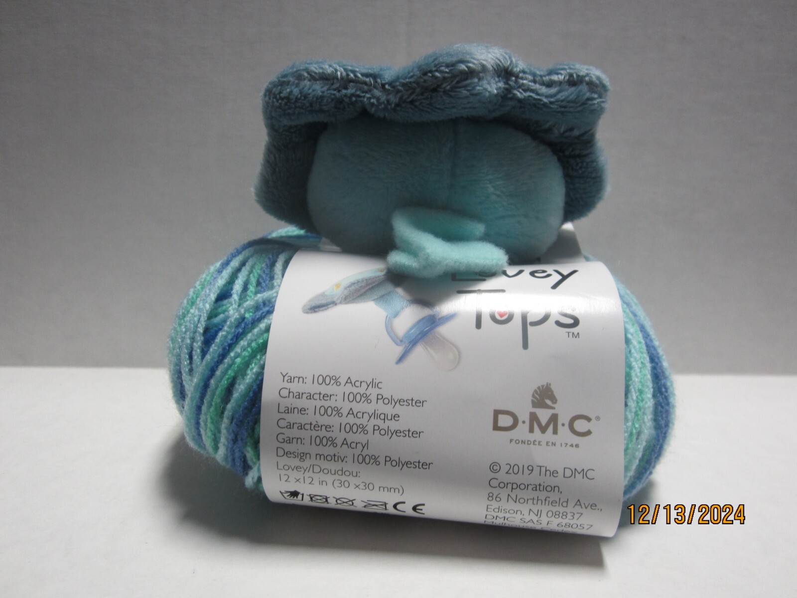 DMC Lovely Tops Pacifier Clip & Yam Blanket Kit Dinosaur; Pattern Inside