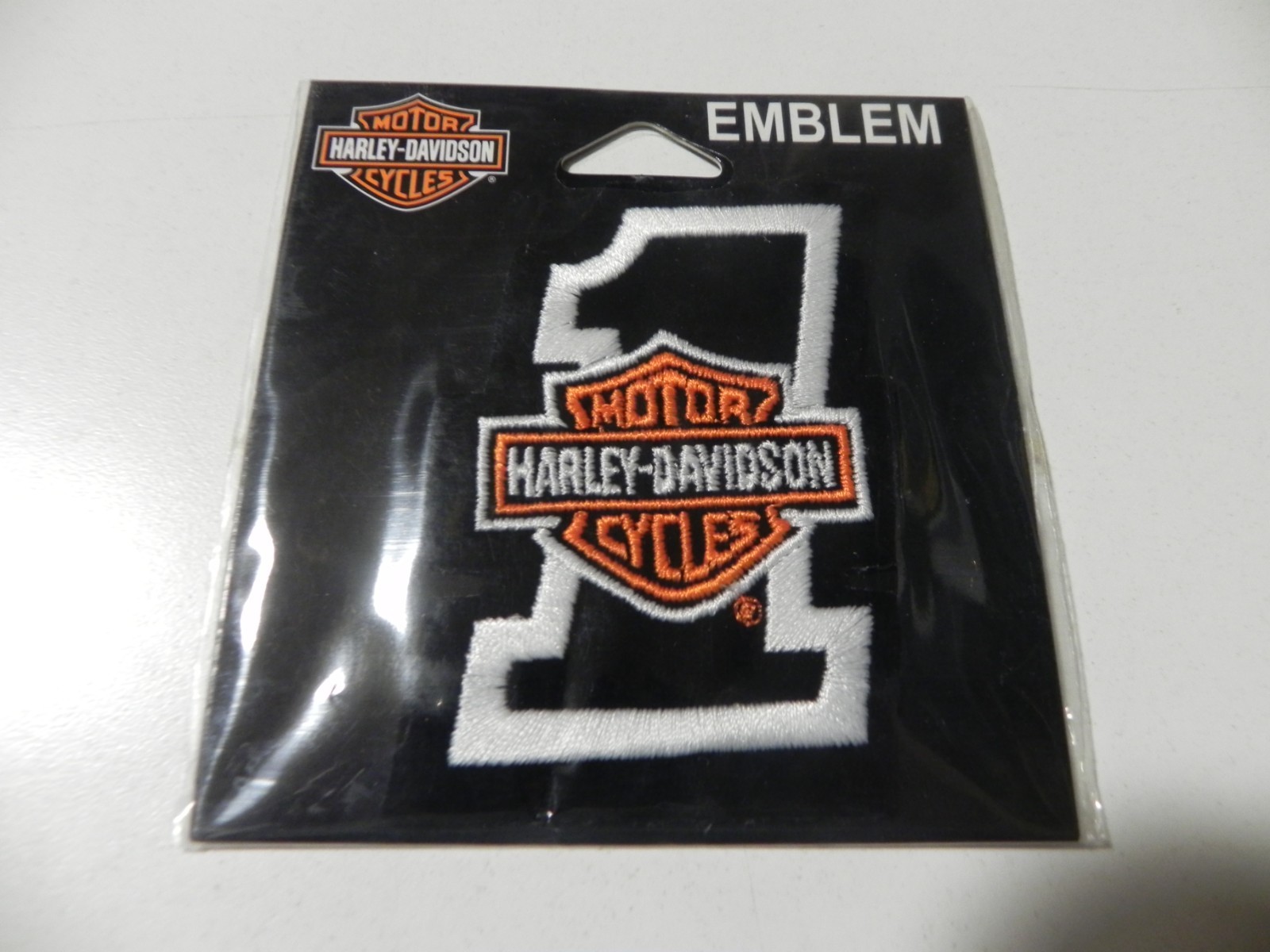 Harley Davidson #1 Emblem Black and Orange Patch New in Package 3" x 2"