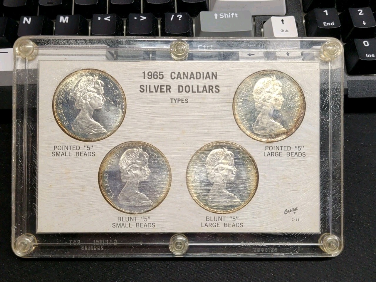 1965 Canadian Silver Dollar Set Of (4) Dollar Types. Capital C-38. 2.40ozt. AG!!