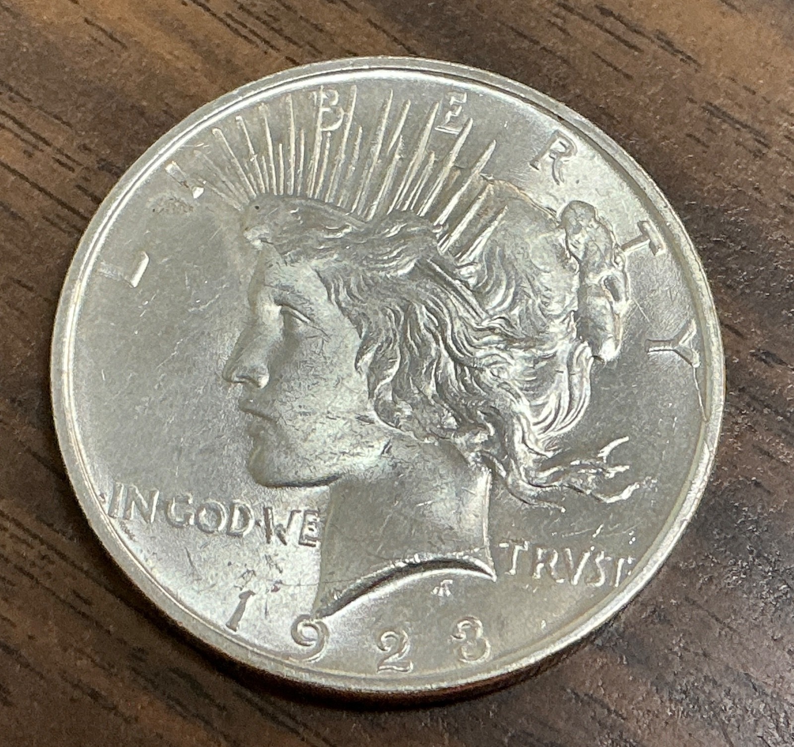 1923-D - $1 Peace Silver Dollar - BU - Die Breaks