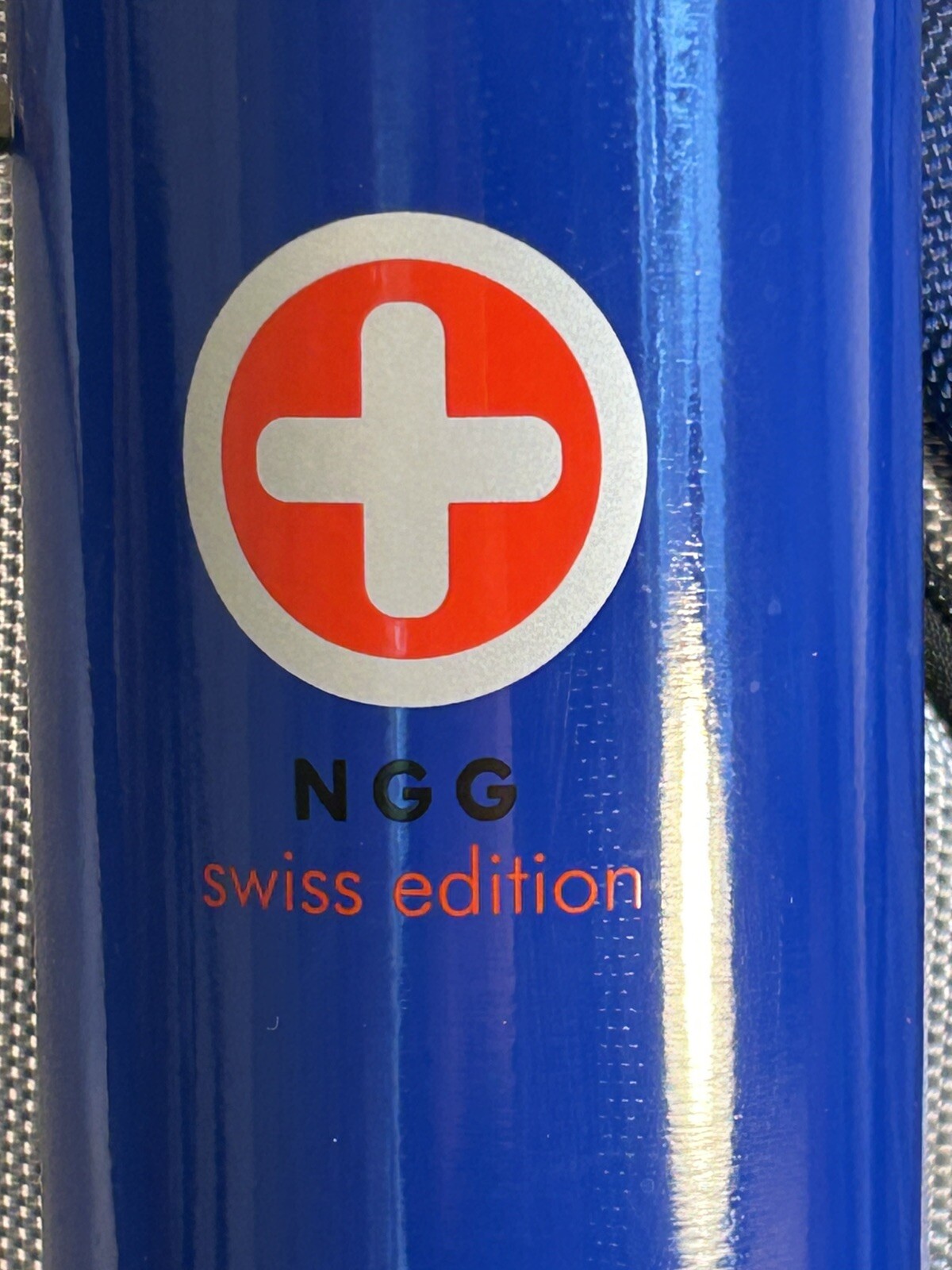 Blue/Grey NGG Swiss Edition Backpack with blue water bottle computer school