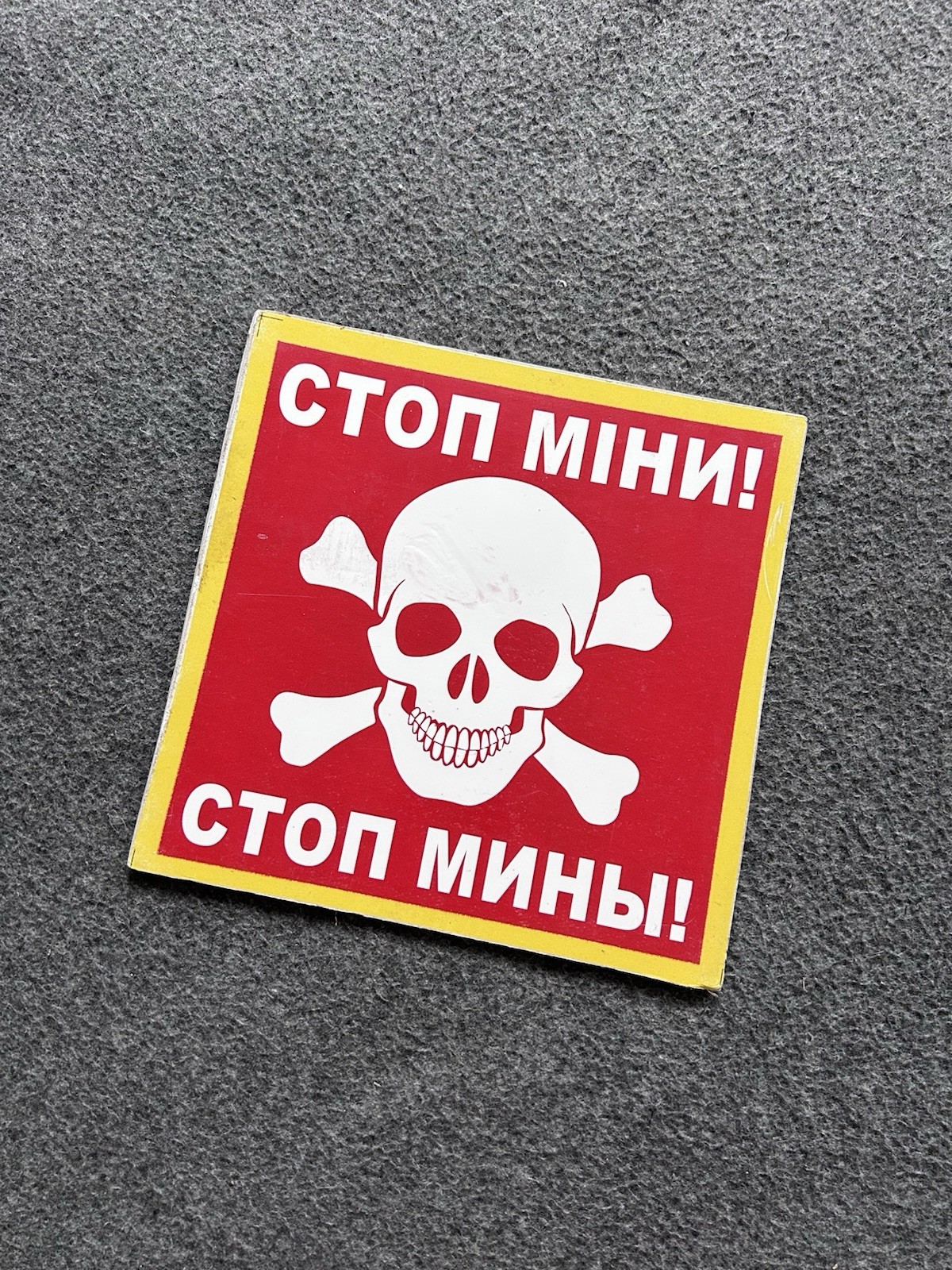 Large square “Stop Mines” sign from demined areas of Ukraine, Kharkiv region