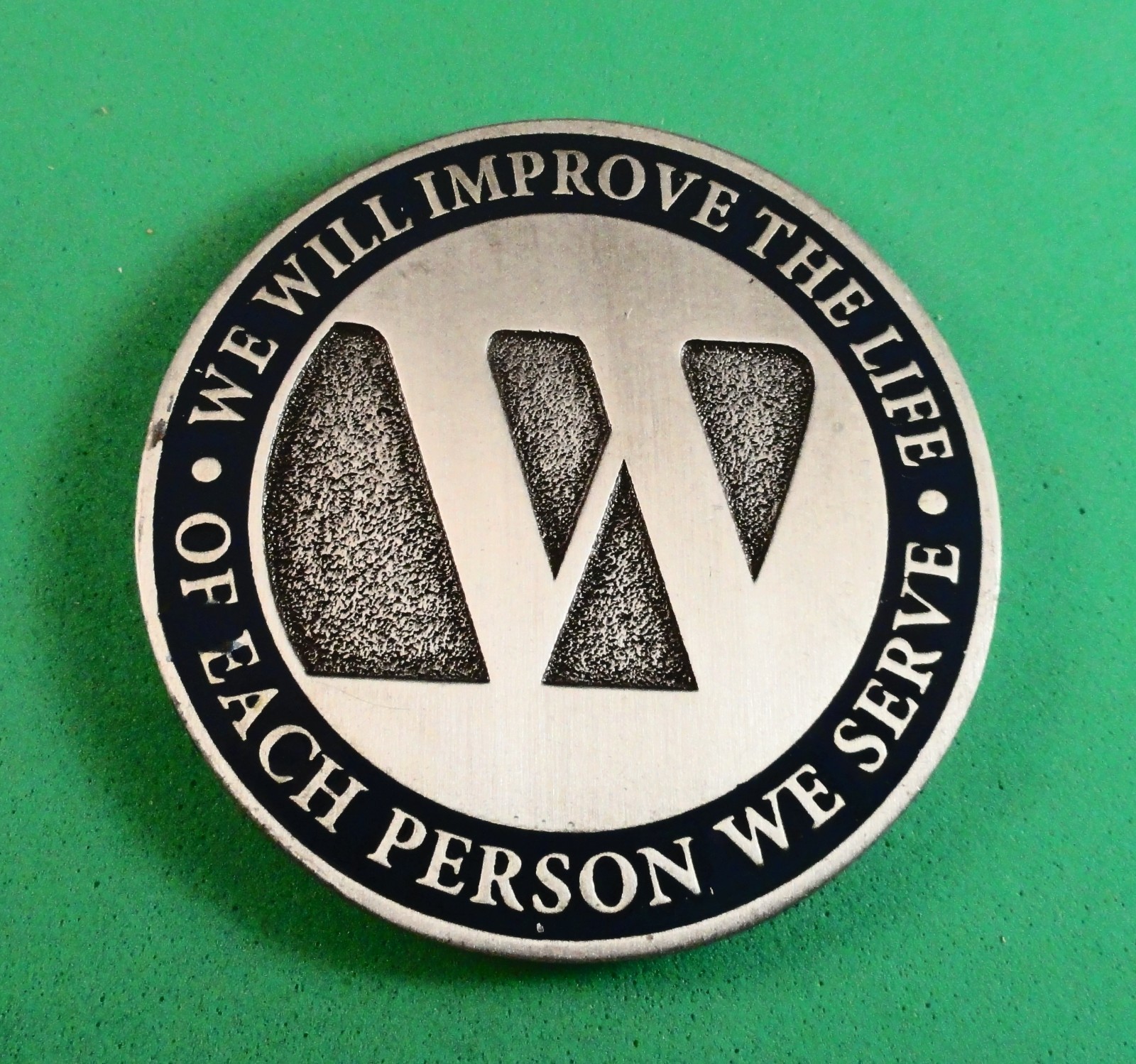CHALLENGE COIN: WE WILL IMPROVE THE LIFE OF EACH PERSON WE SERVE