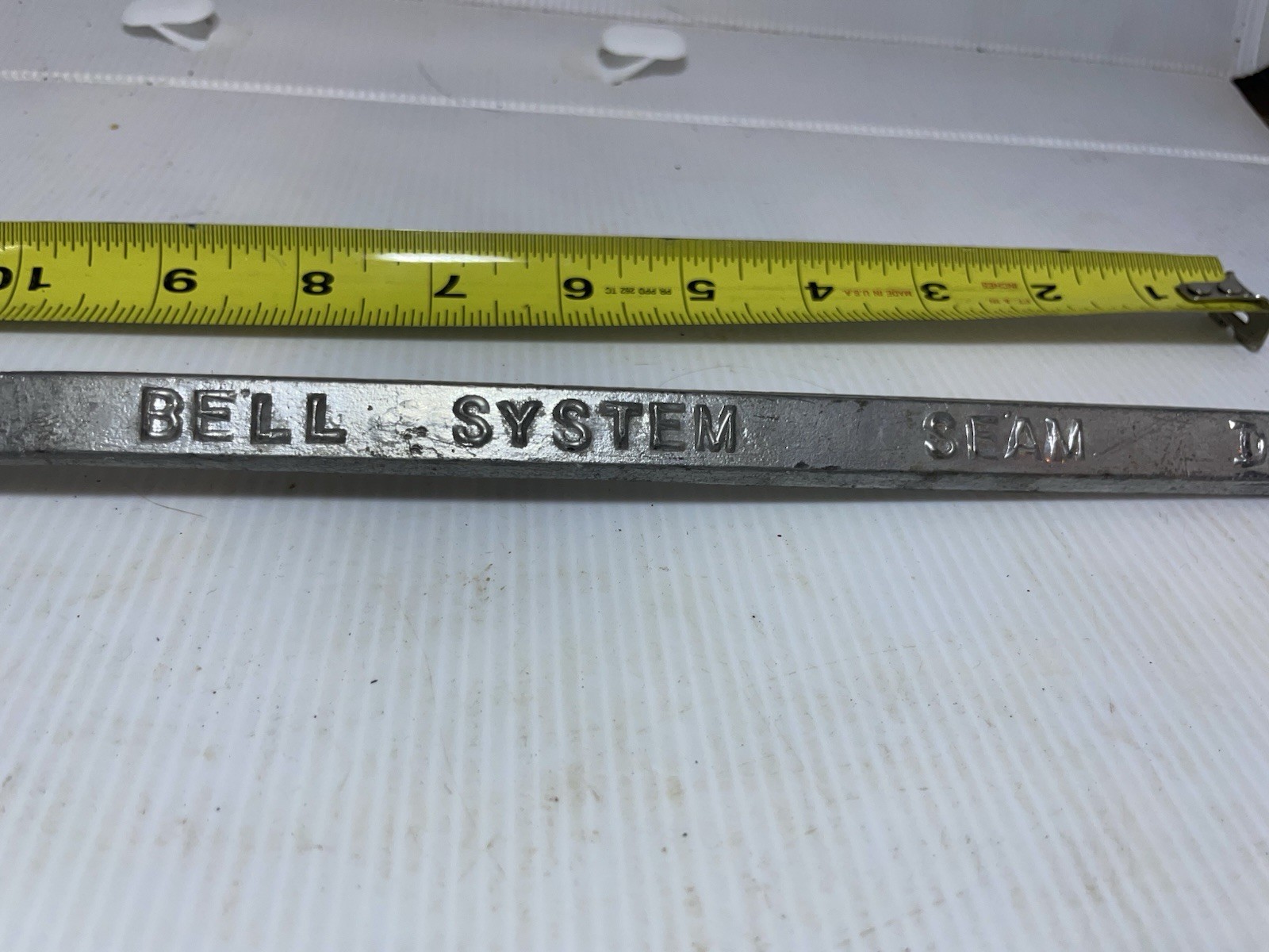 Vintage Bell System D Seam solder telephone cables in manholes