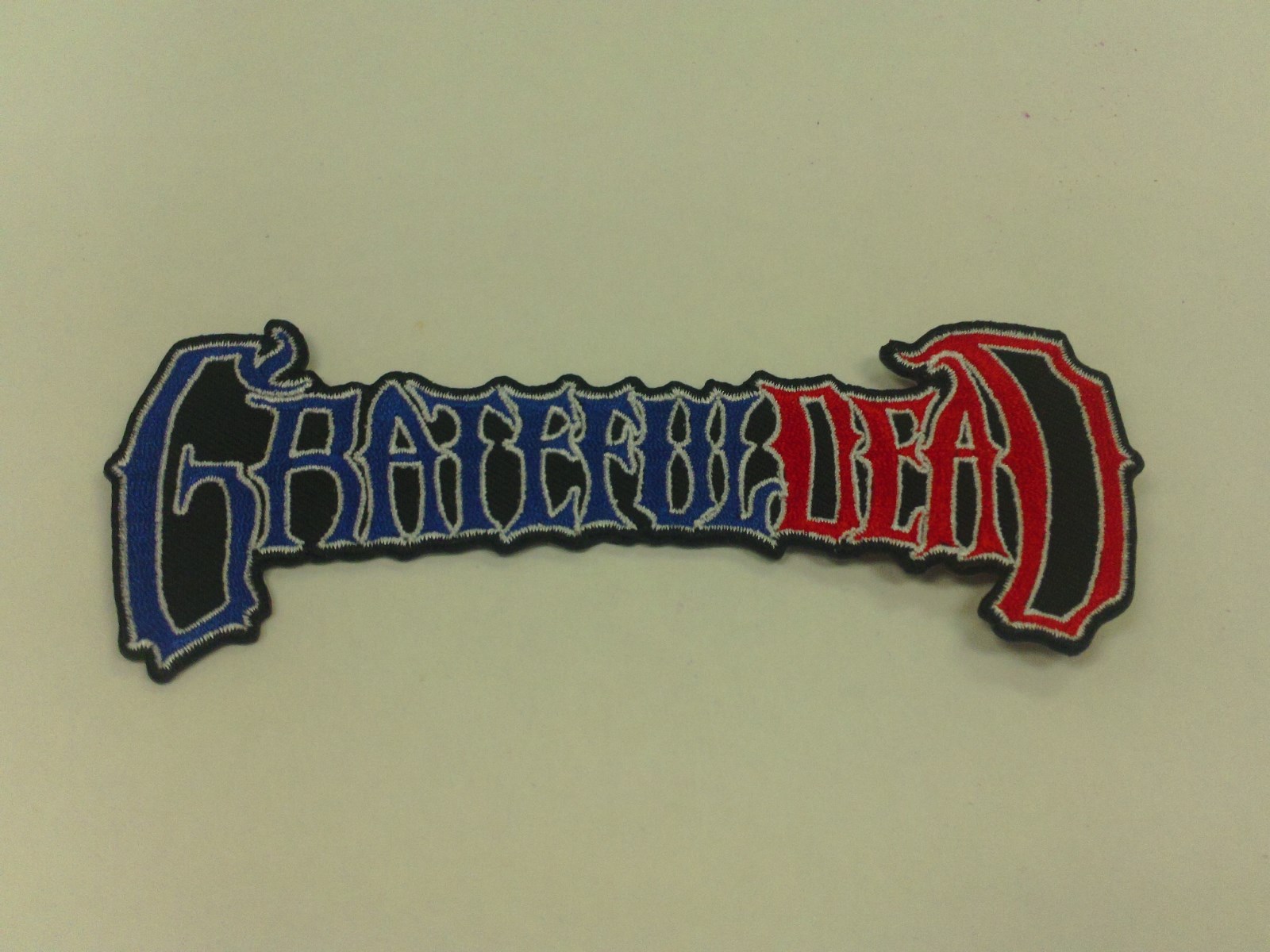 GRATEFUL DEAD EMBROIDERED PATCH RED WHITE AND BLUE LOGO 5" X 2"