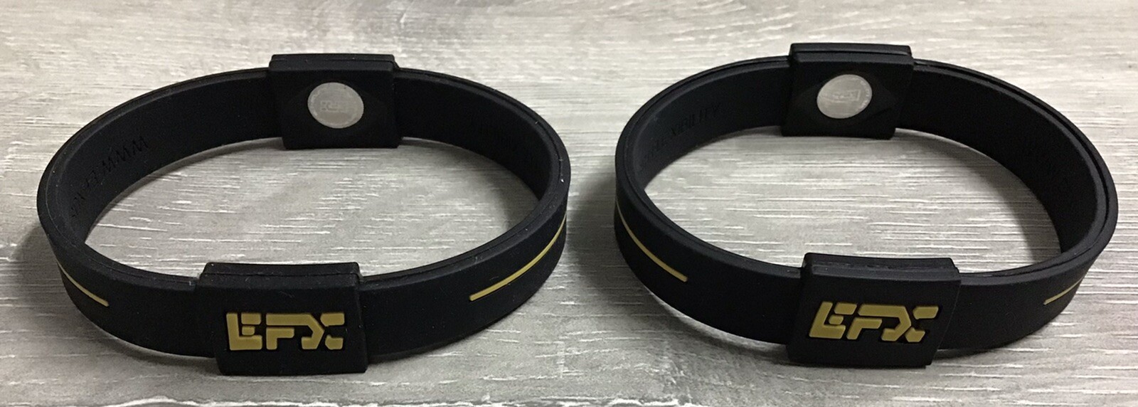 (LOT OF 2) EFX Hologram Silicon Balance Wristband Black/Yellow - M- NEW - NO BOX