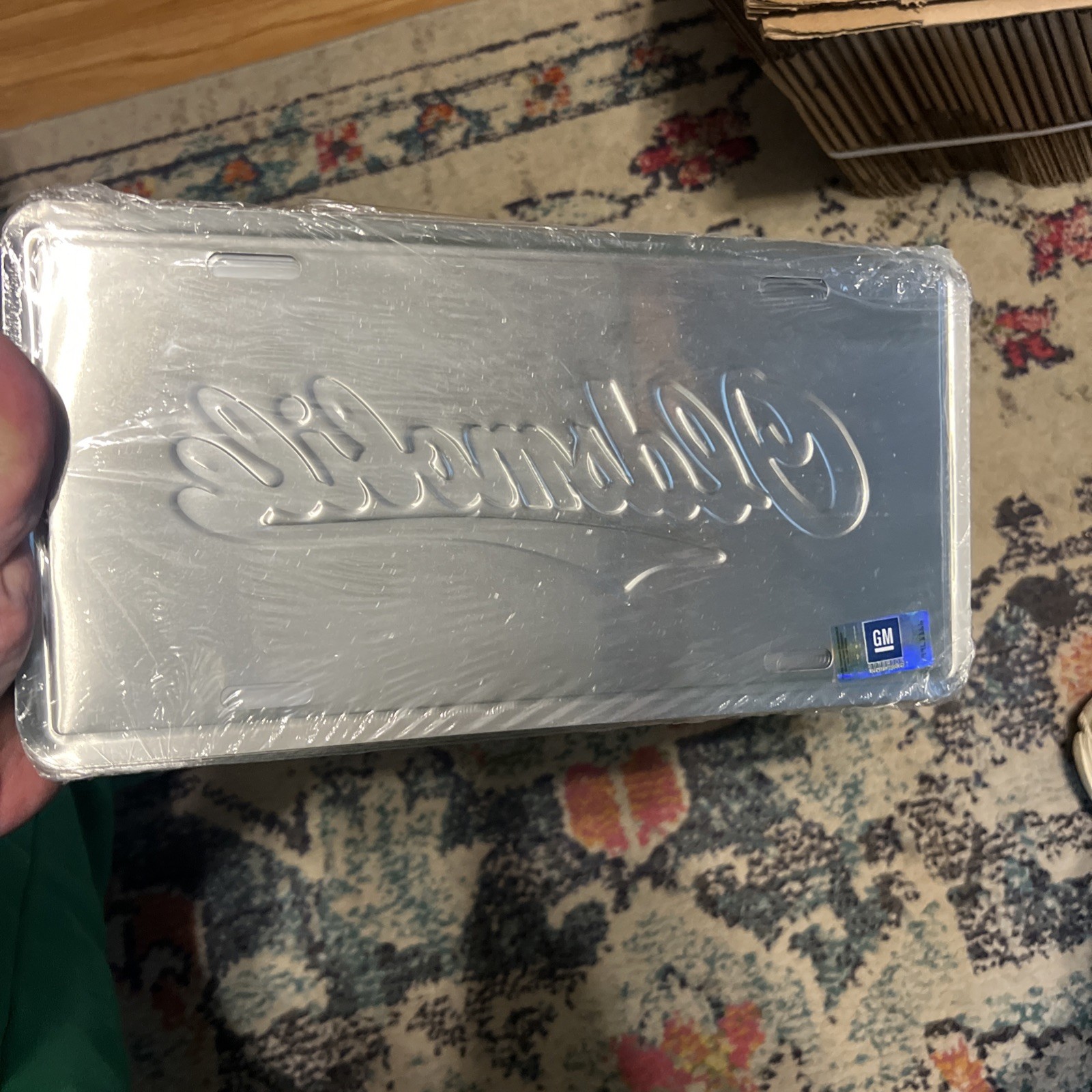 Vintage Oldsmobile Booster License Plate Sealed