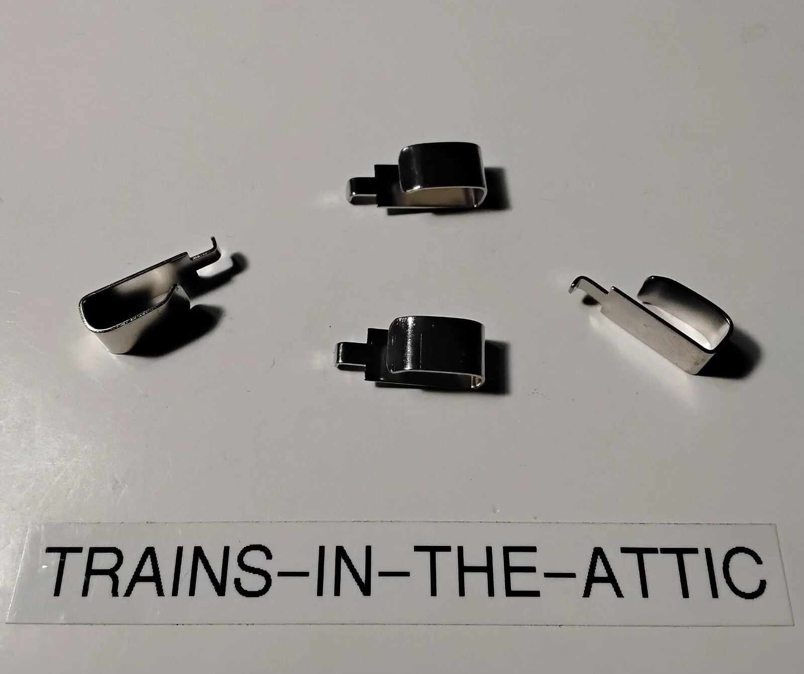 LIONEL COLLECTOR SLIDE SHOE PART 1661-33. PACK OF (4). NEW