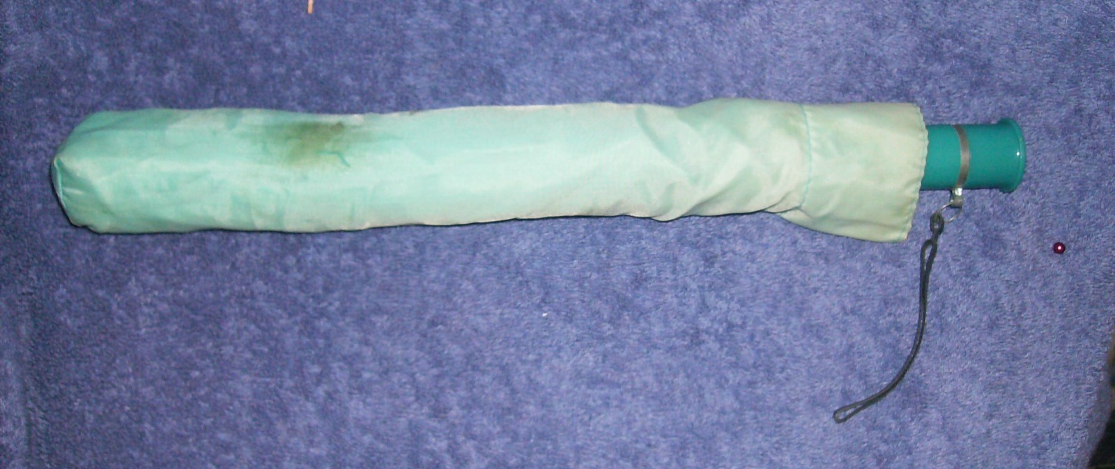 BLUE UMBRELLA  100% POLYESTER NYLON NEVER OPENED BUT STORED IN CAR FOR 2 YEARS