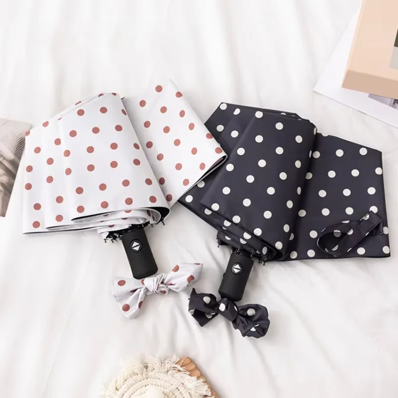 A simple and elegant black and white polka dot tri-fold umbrella a mini fully au