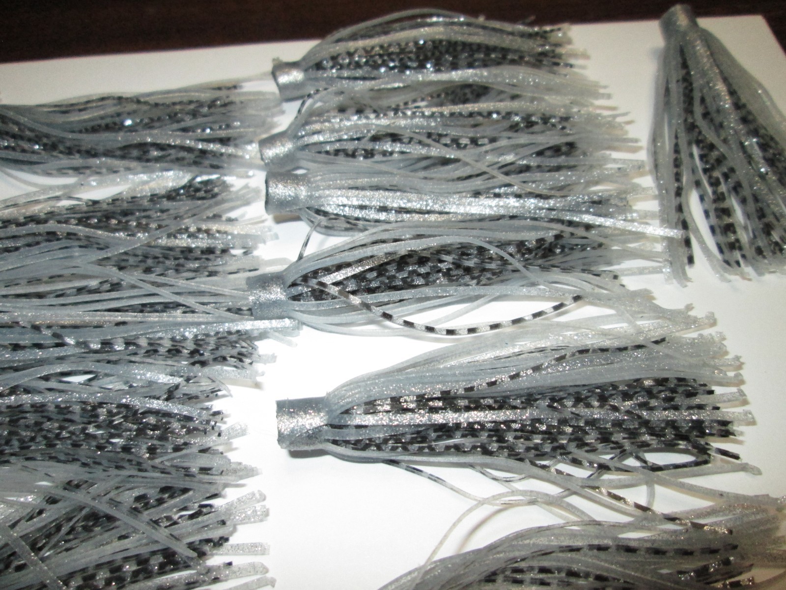 25 - QUICK CHANGE SILICONE RUBBER SKIRTS - 3" LONG - SILVER AND BLACK,,