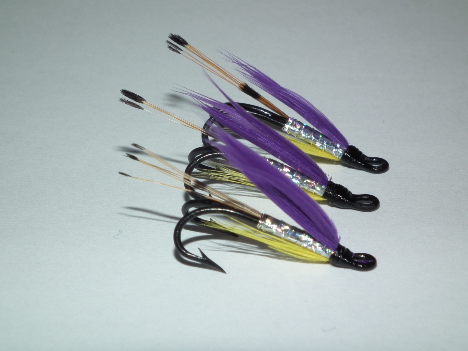 salmon/seatrout flies - 3 yellow & purple tied on  mustad size 12 double hooks