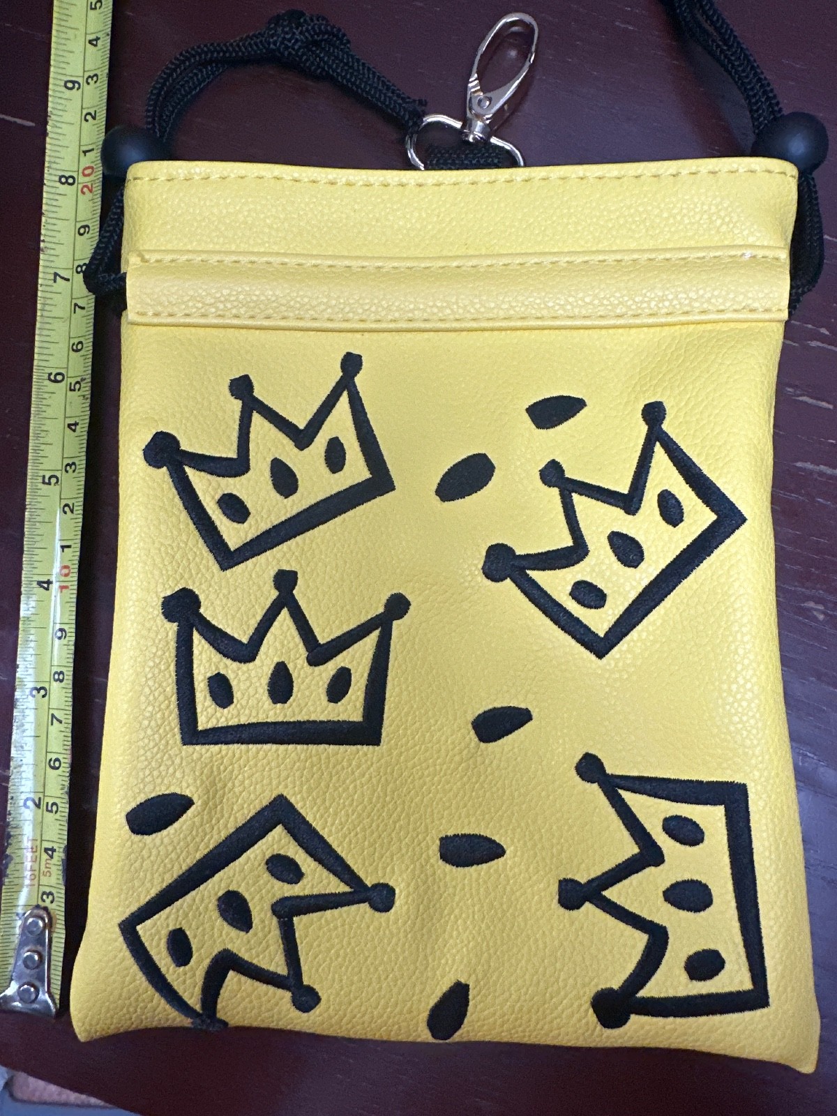 Crown yellow texture golf accessory pouch, drawstring close with attaching clip.
