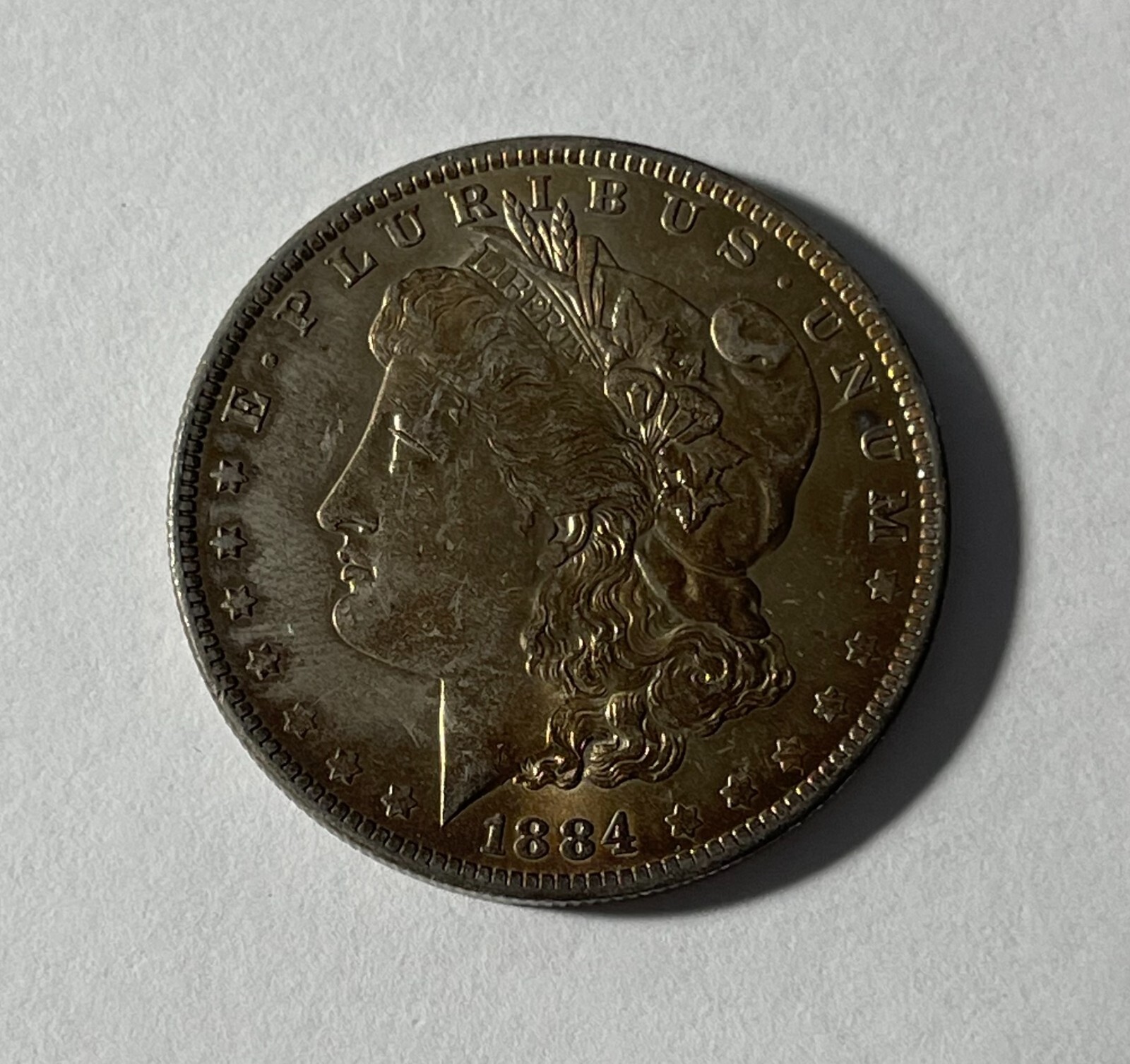 1884-O Morgan silver dollar (#17549) BU+ Obv. Is fully gold toned. Very nice.