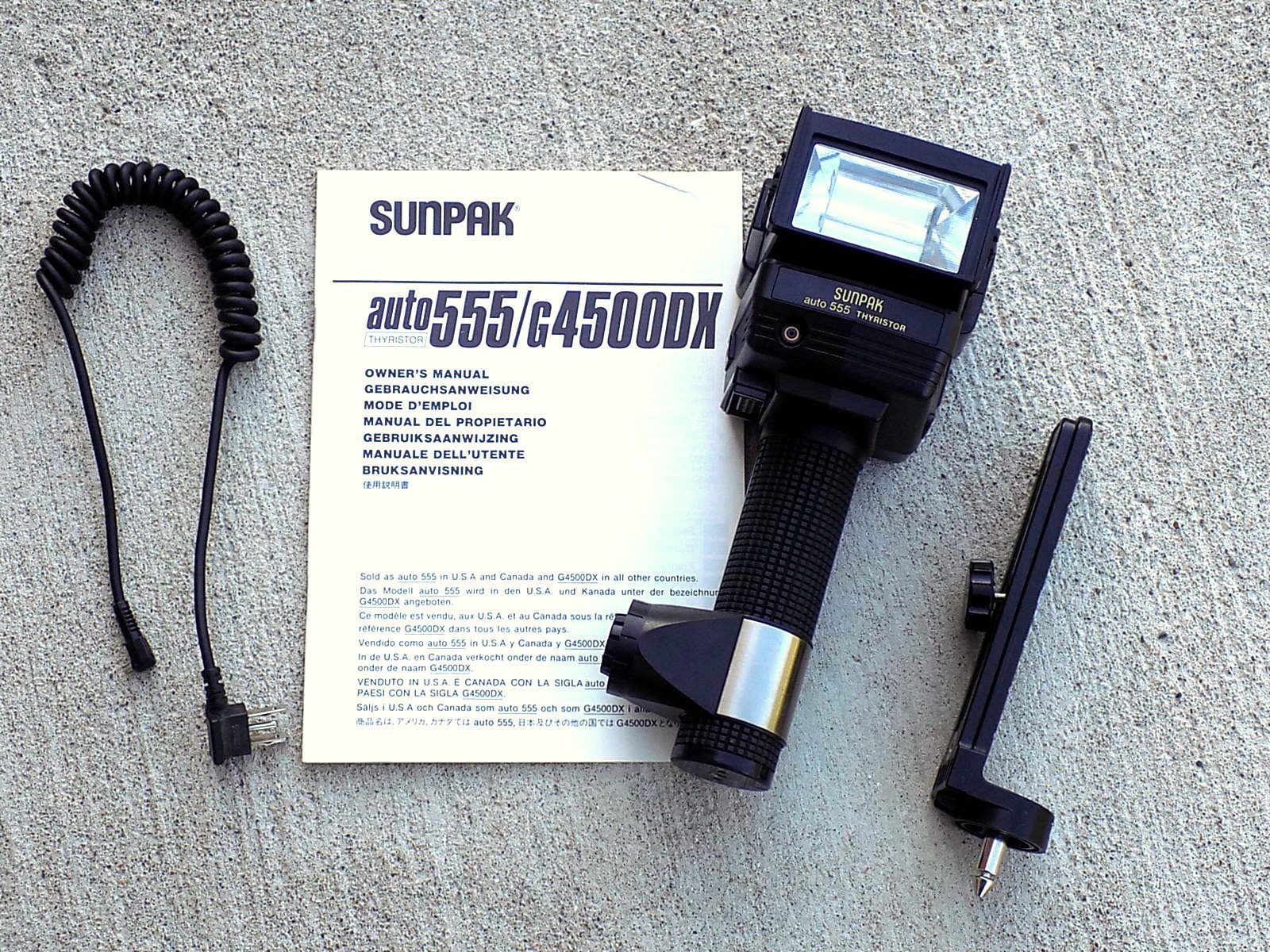 Sunpak Auto 555 Thyristor Handle Mount Strobe Flash w/Bracket, Cable, & Manual
