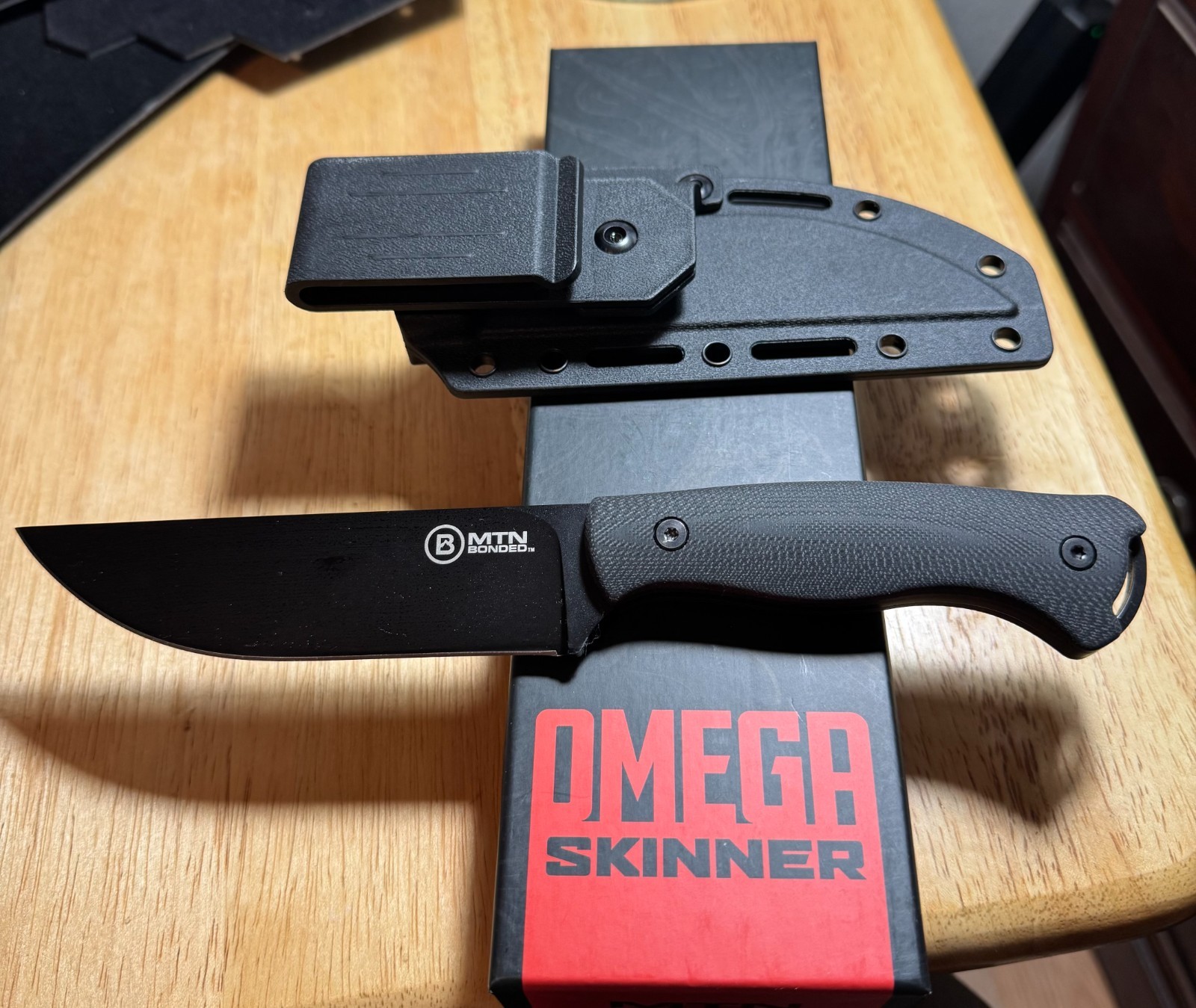 Omega Skinner MTN Bonded Black Knife W/ 360 degree Sheath