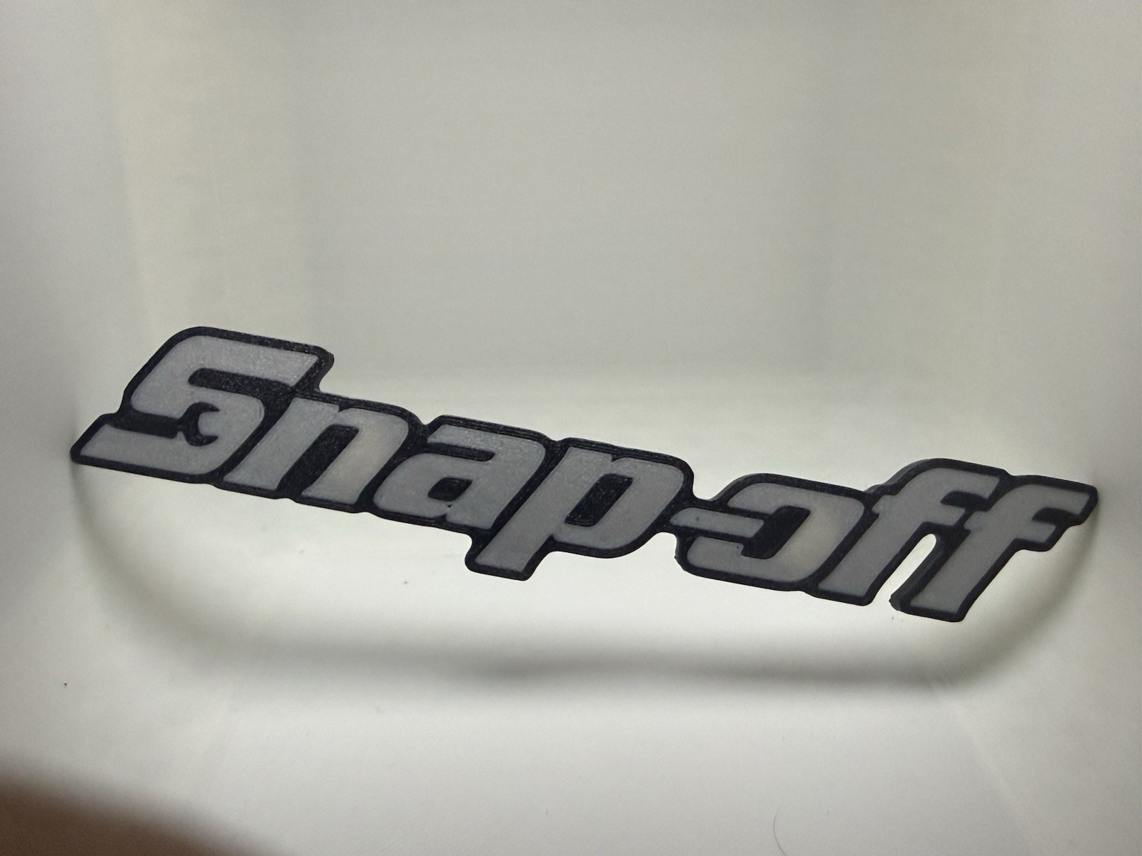 Snap-off Novelty 3D Printed Tool Box Badge.