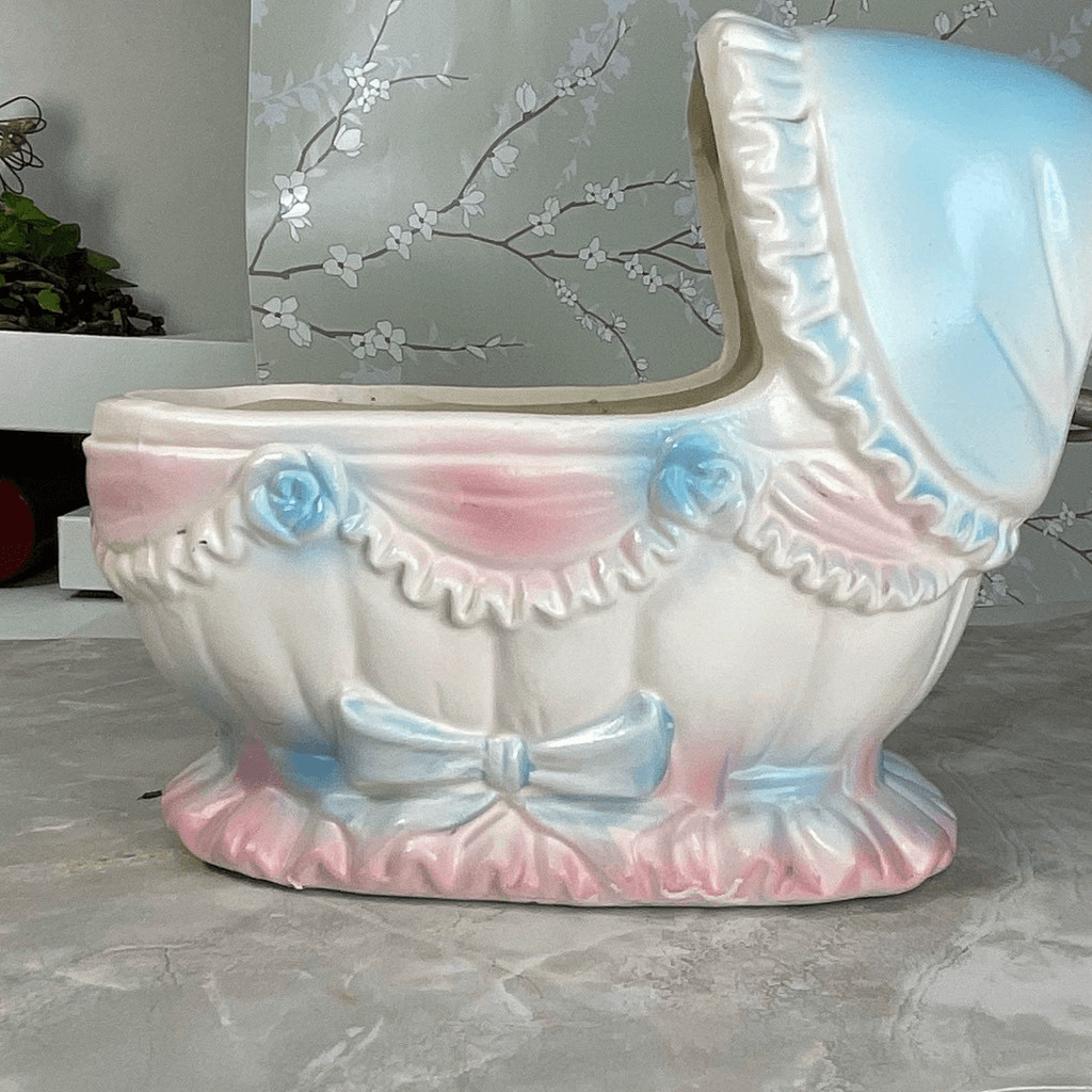 Inarco E- 3502 musical baby bassinet planter.