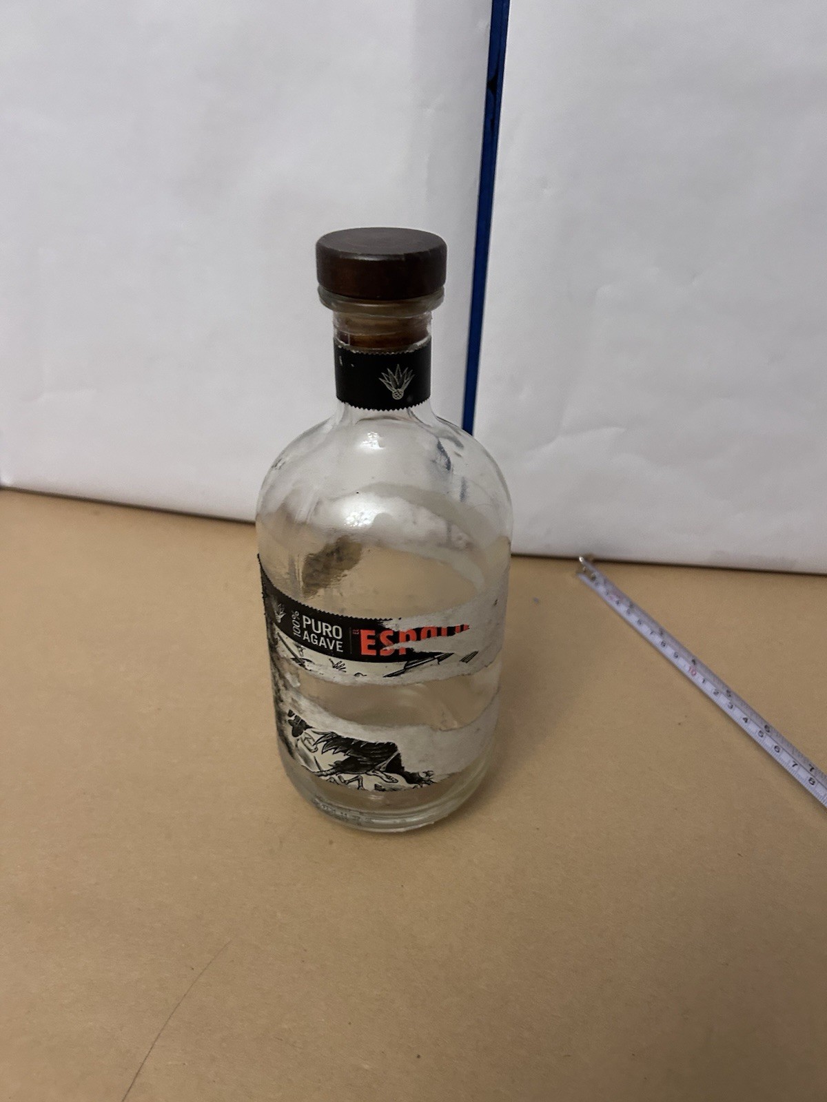 Thick Glass unbranded bottle with cork top likely tequila