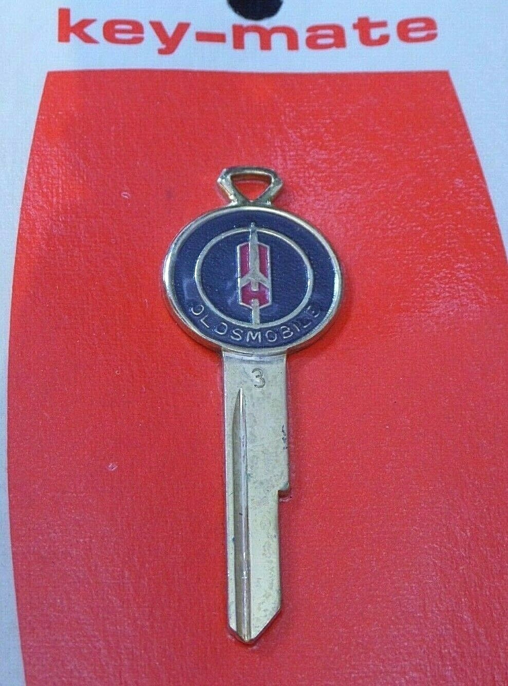 OLDSMOBILE Golden Rocket Crest KEY BLANK 1968 1972 1976 1980 87-89 Cutlass 442